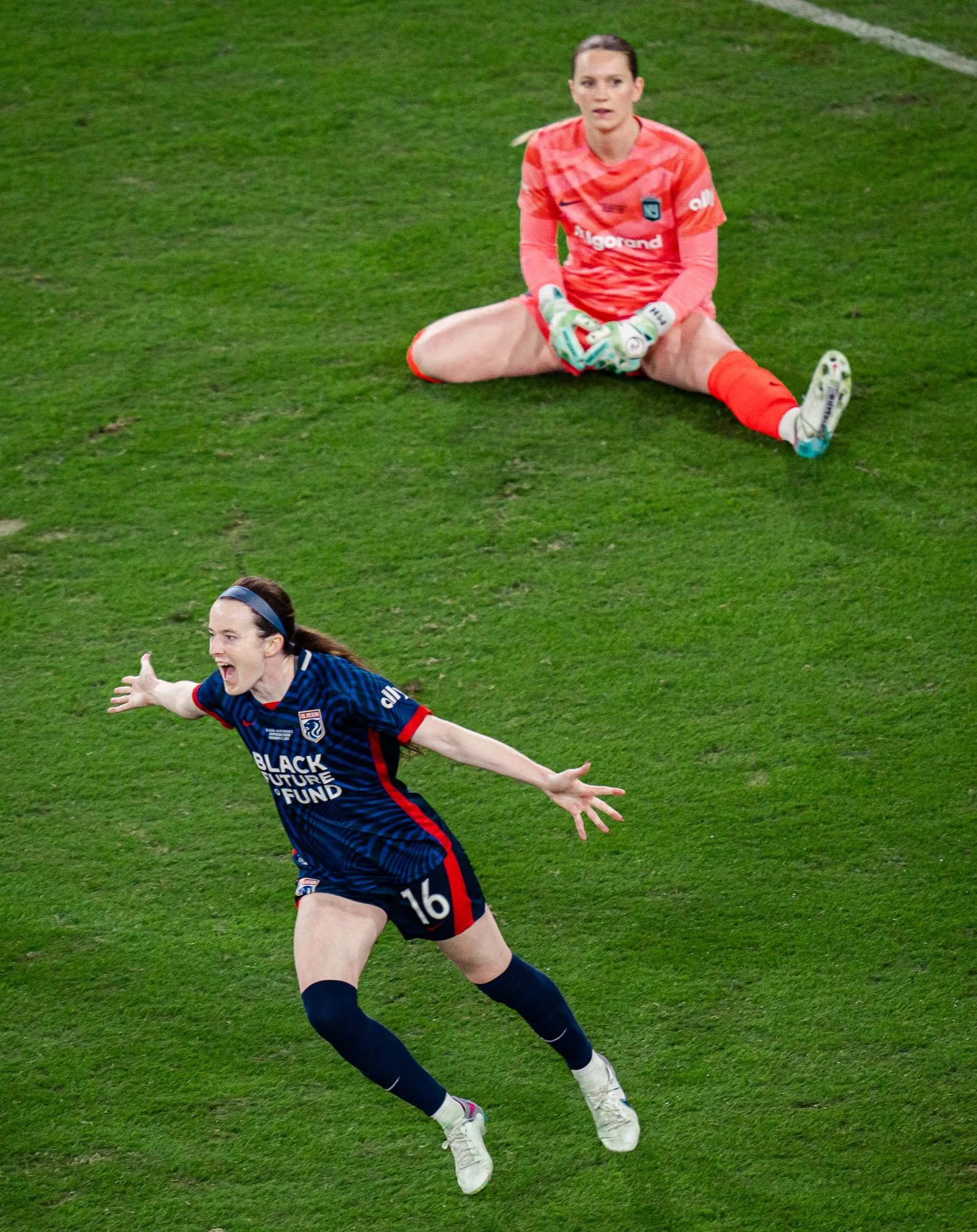 Seattle Reign FC midfielder Rose Lavelle celebrates her goal against Gotham FC during the 2023 NWSL Championship at Snapdragon Stadium in San Diego, California. Gotham FC goalkeeper Mandy McGlynn is visible in the background after the goal. (Cody Cer