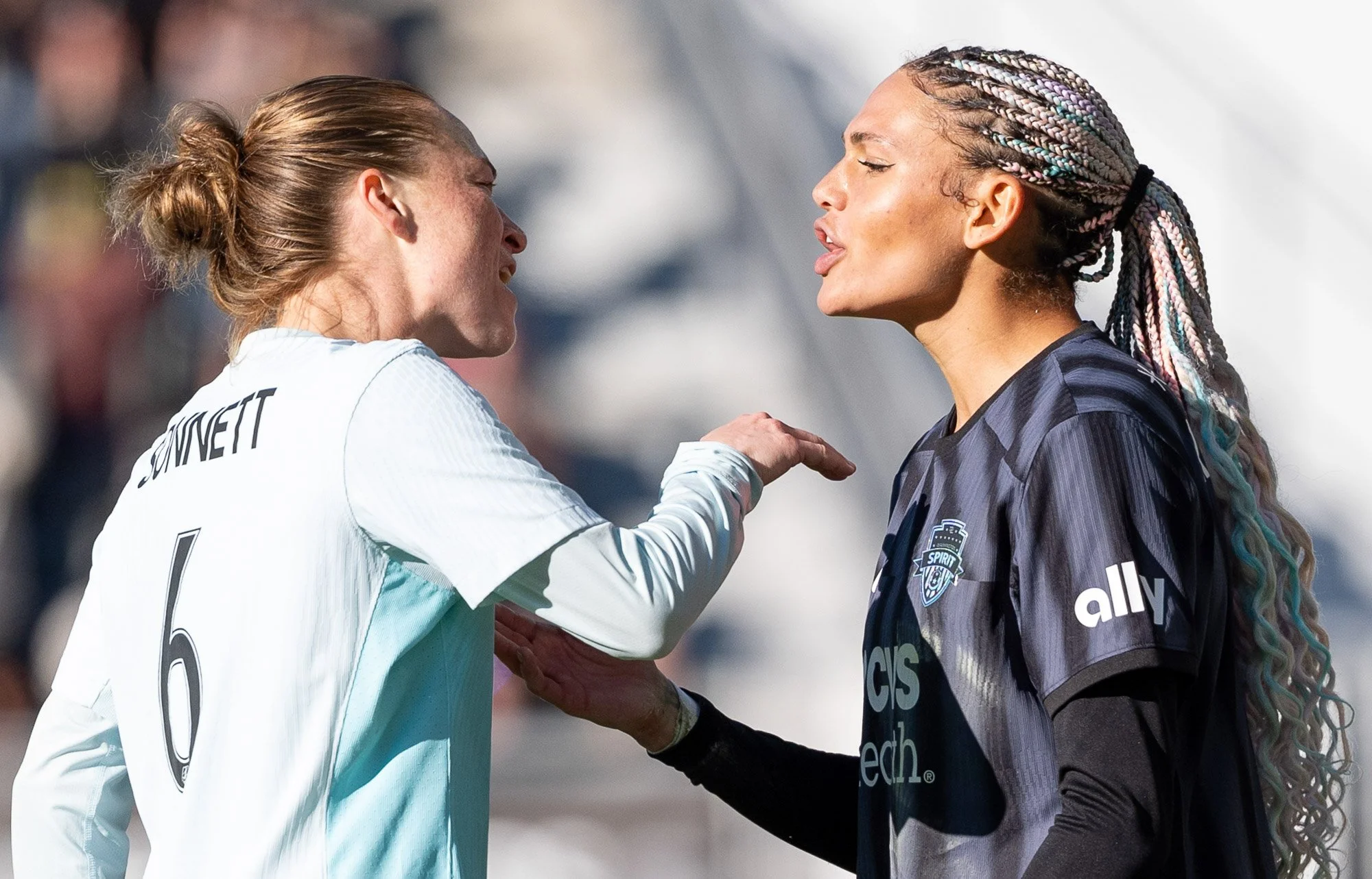 Washington Spirit forward Trinity Rodman reacts following a foul as she exchanges words with Gotham FC defender Emily Sonnett during the 2024 NWSL Playoff Semifinal at Audi Field. (Cody Cervenka/Crvnka Photography)