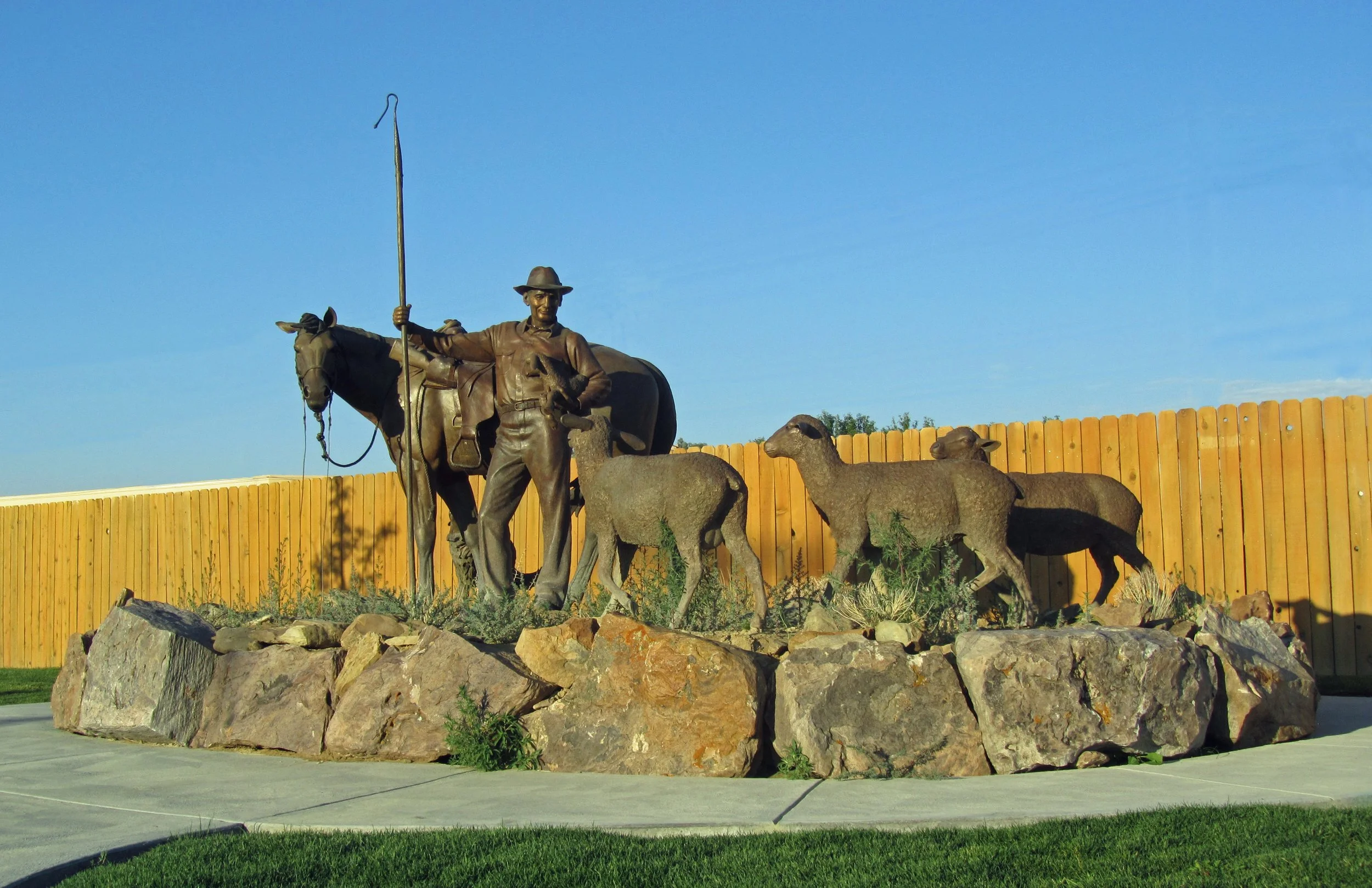 Life-sized shepherd, sheep, lambs, horse and dog.