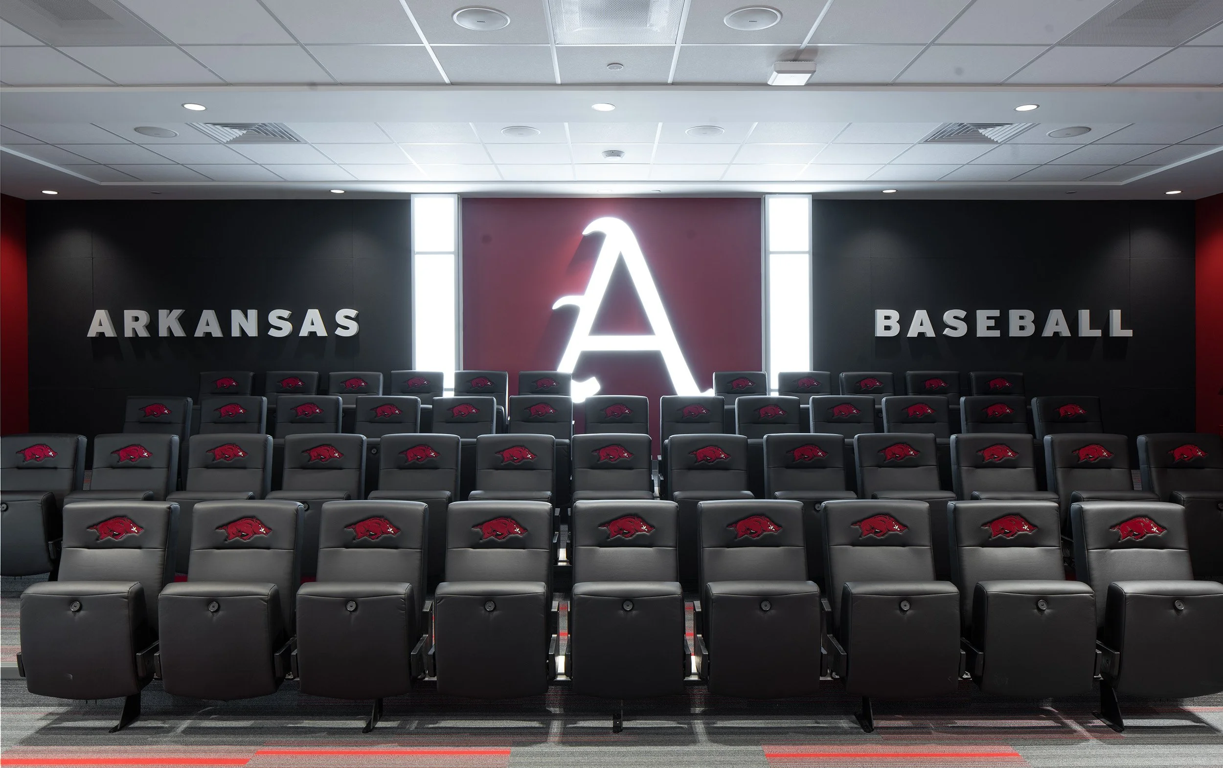 University-of-Arkansas-Baseball-Development-Center-Team-Meeting-Room-all-lights-on-ambient-reference.jpg