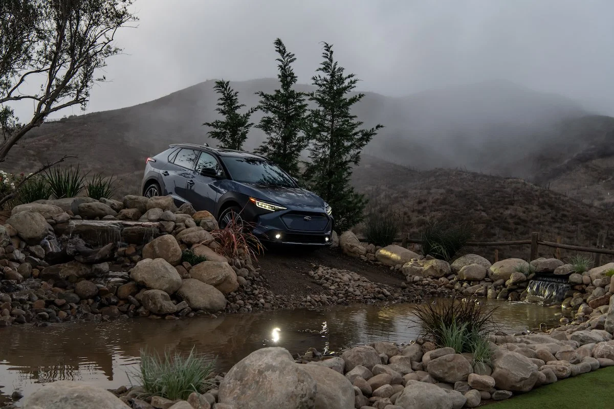 Subaru Solterra electric SUV crossing a river