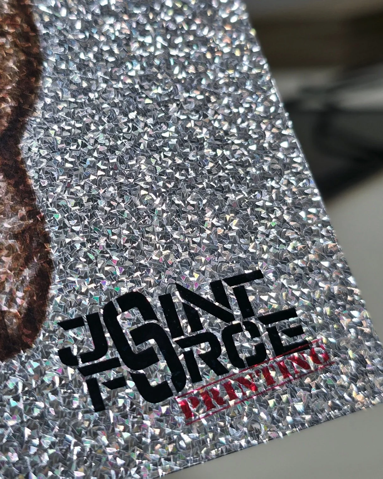 Here is a close-up preview of one of our Holiday cards on "Stardust Crackle" stock. Can you guess what the image will be? 🤔

 #printshop #greenwoodindiana #holidaycard #christmascard