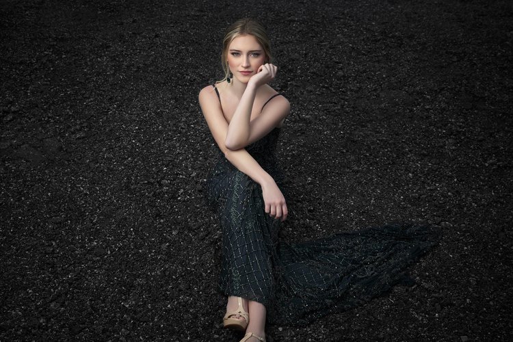 Senior portrait photograph of Tilghman high school graduate Hope Arterburn from Paducah, on location city photograph of senior girl in epic flowing black dress on blacktop pavement, taken by Western Kentucky Photographer Brad Rankin.