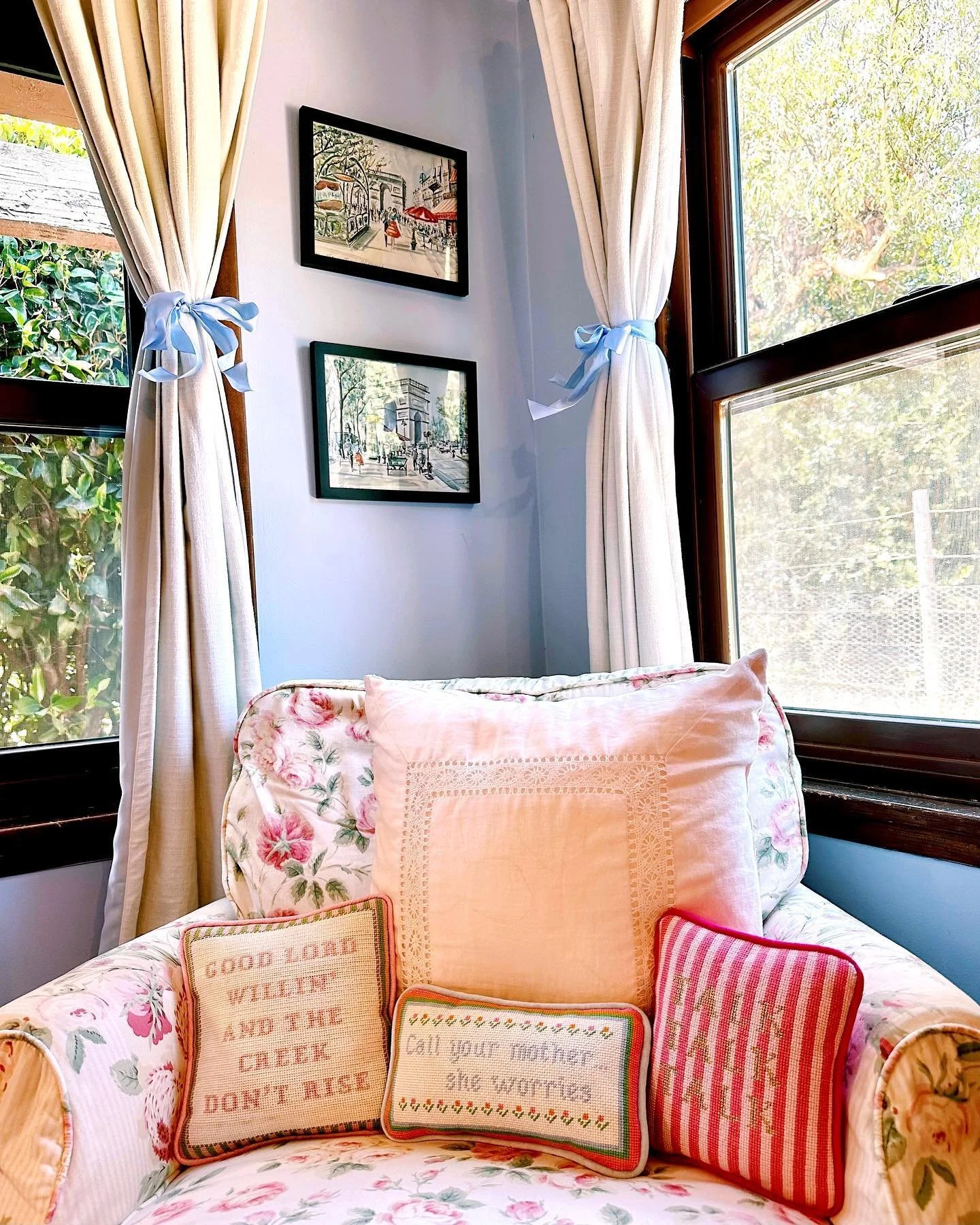 obsessed with my little pink stitching corner at the ranch! 🩷🪡 took my pillows out of storage to add to this vintage floral chair (which compliments my stitching bag perfectly!)