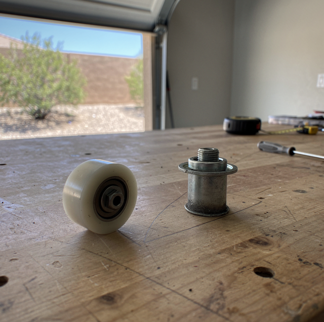 garage door roller with nylon wheel on workbench
