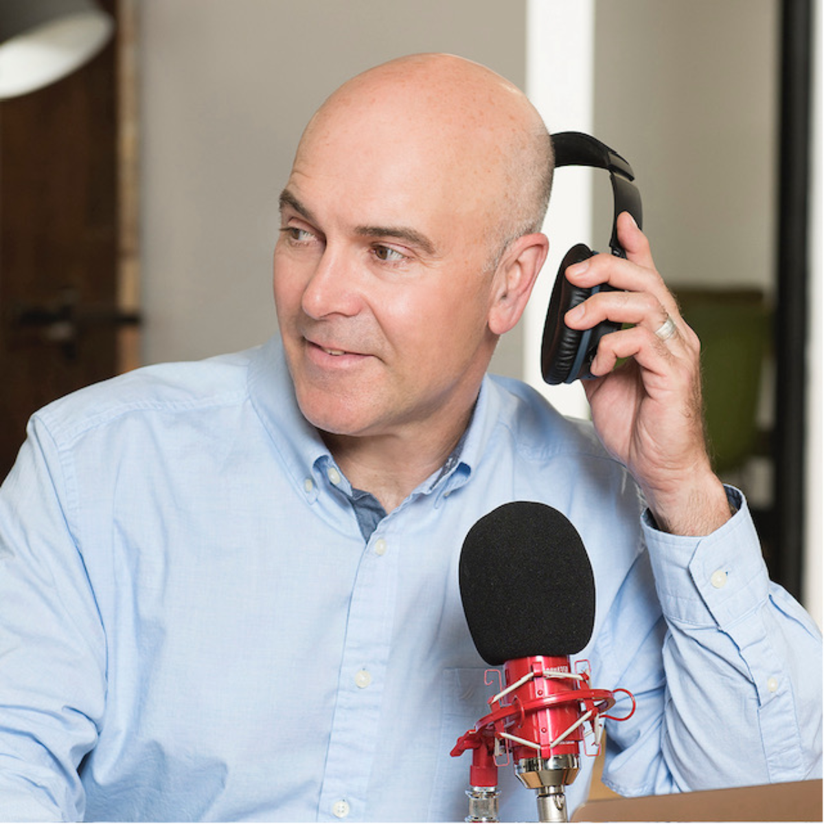 Jim Beretta headshot at a podcast