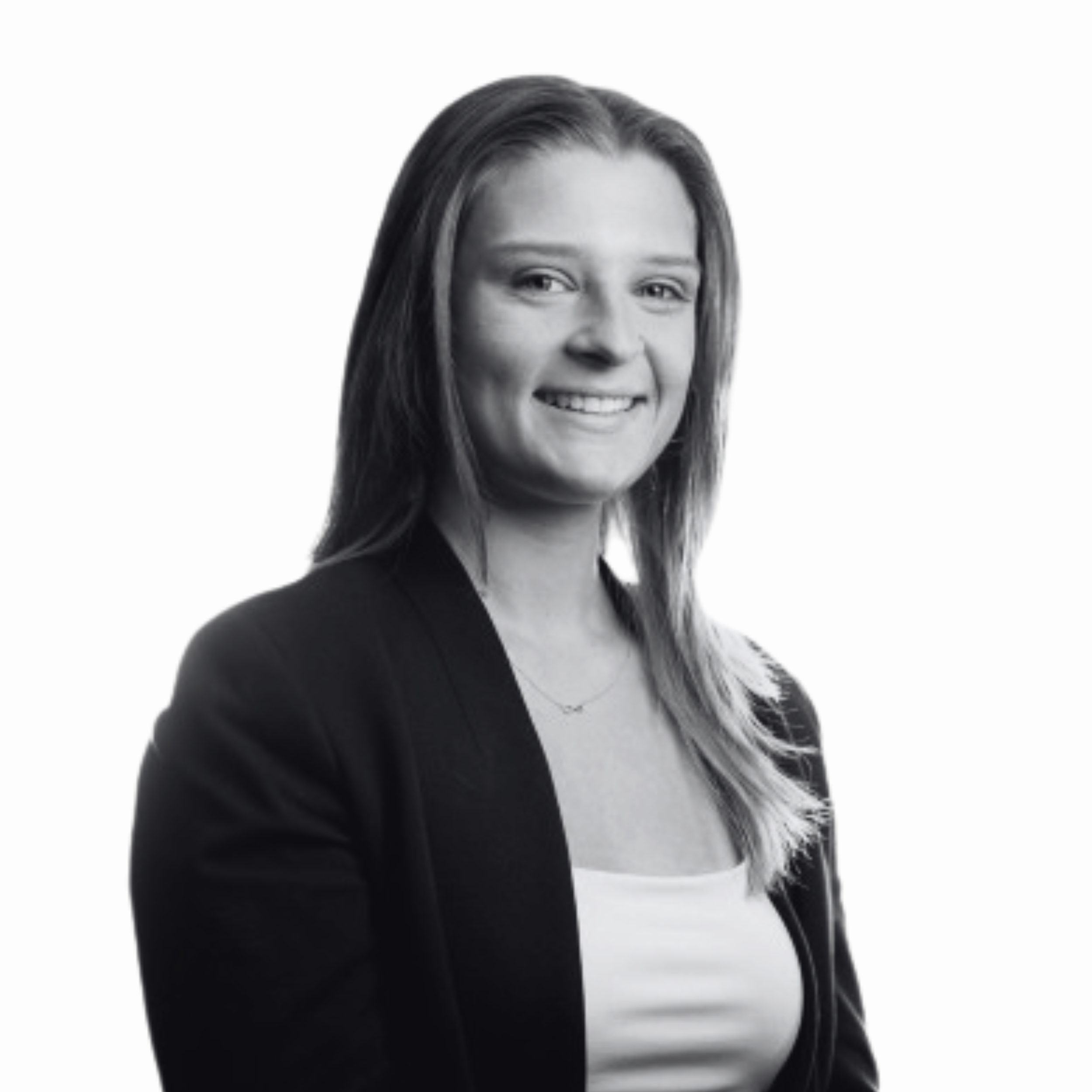 Black and white portrait of a smiling woman with long hair, wearing a blazer and a light-colored top.