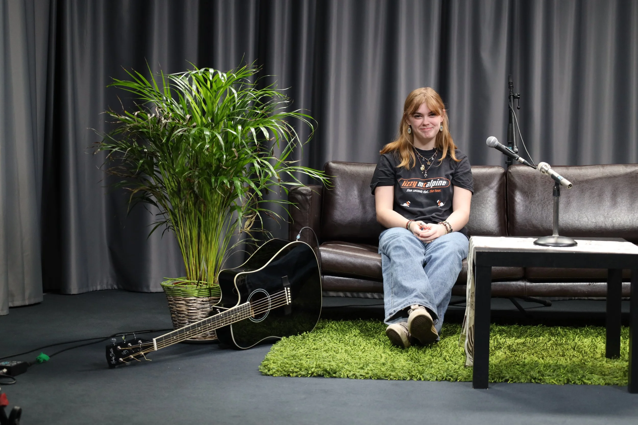 Geometric drawing of an outline square with sections divided by vertical, horizontal, and half circle lines.