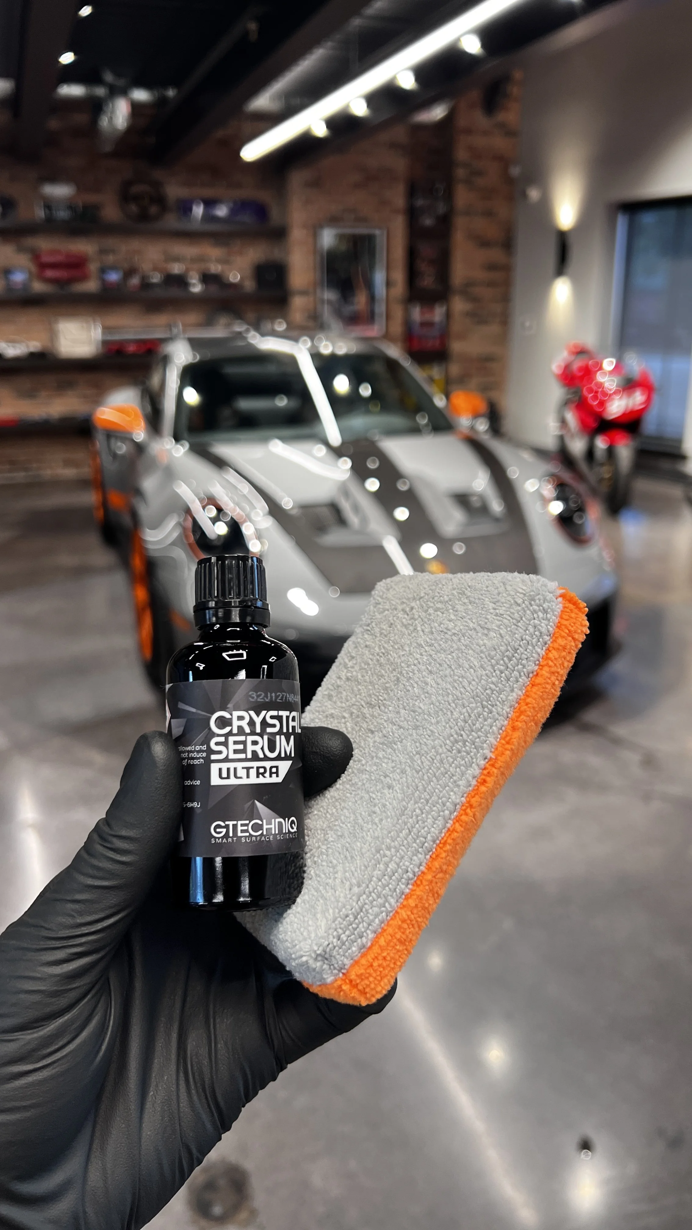 Gtechniq Crystal Serum Ultra Ceramic Coating being applies to a Porsche GT3rs