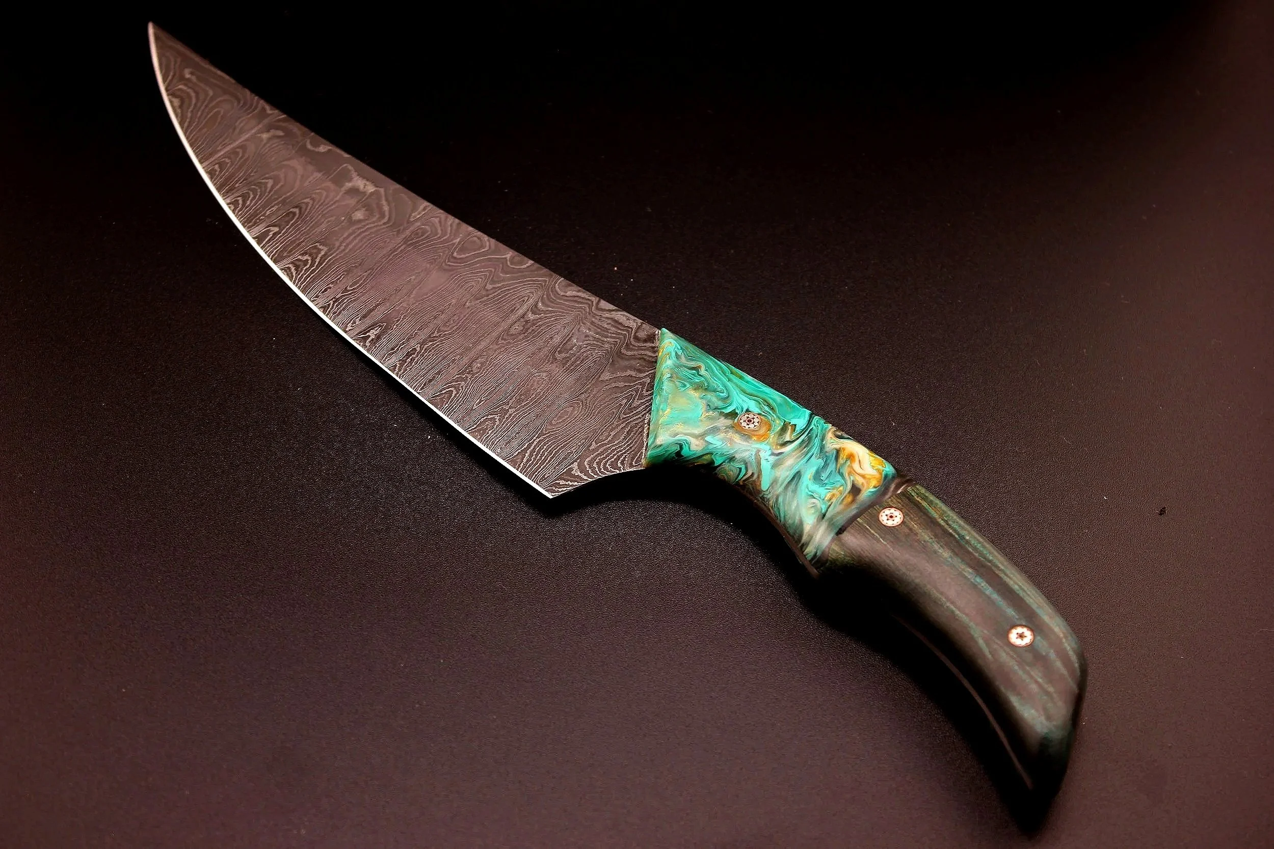 11 inch modern chefs knife made from damascus steel and hybrid knife scales made from stablized maple and urethane resin.