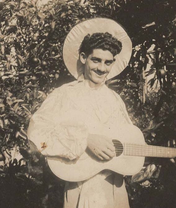 Sam ready to serenade with his Spanish guitar (1930s)
