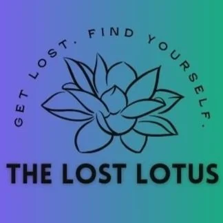 A stylized lotus flower illustration with the text "Get lost. Find yourself. The Lost Lotus" around and below it, against a blue-green gradient background.
