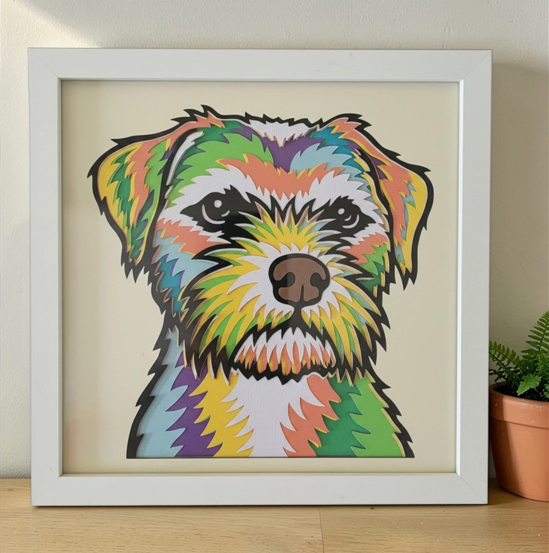 BORDER TERRIER WHITE FRAME WITH PLANT.jpg