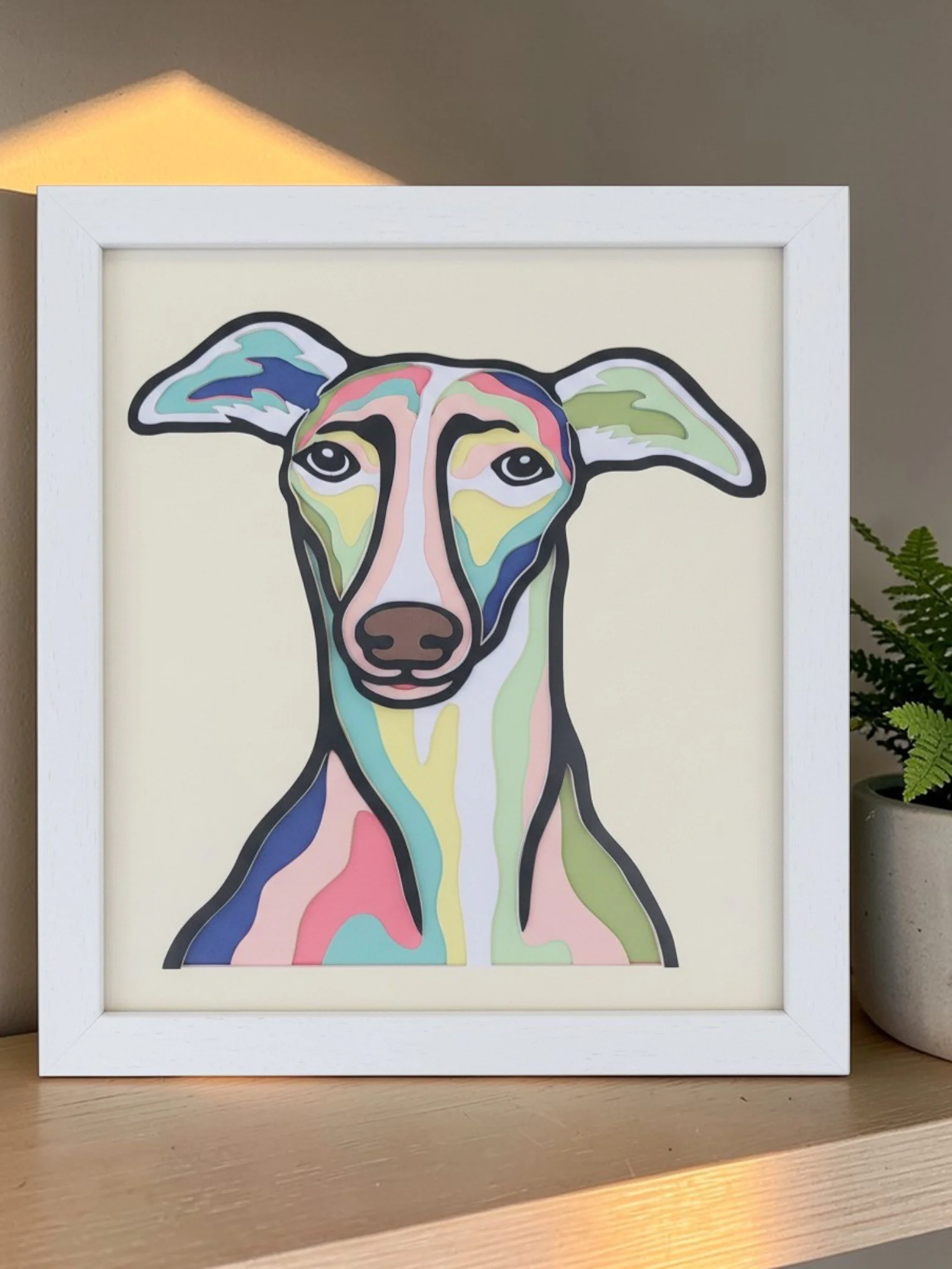 GREYHOUND WHITE FRAME WITH PLANT.jpg