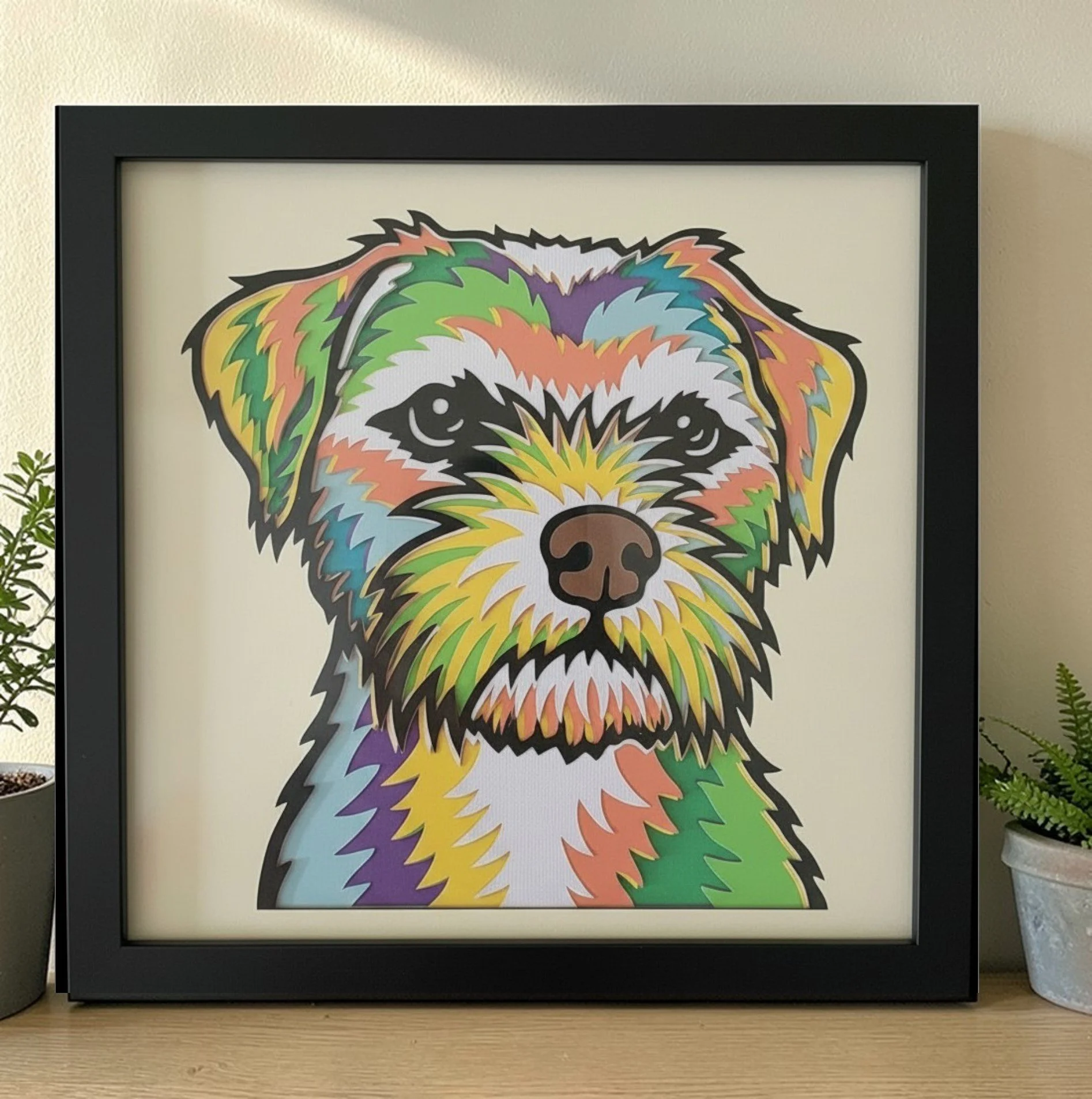 BORDER TERRIER BLACK FRAME WITH PLANT.jpg