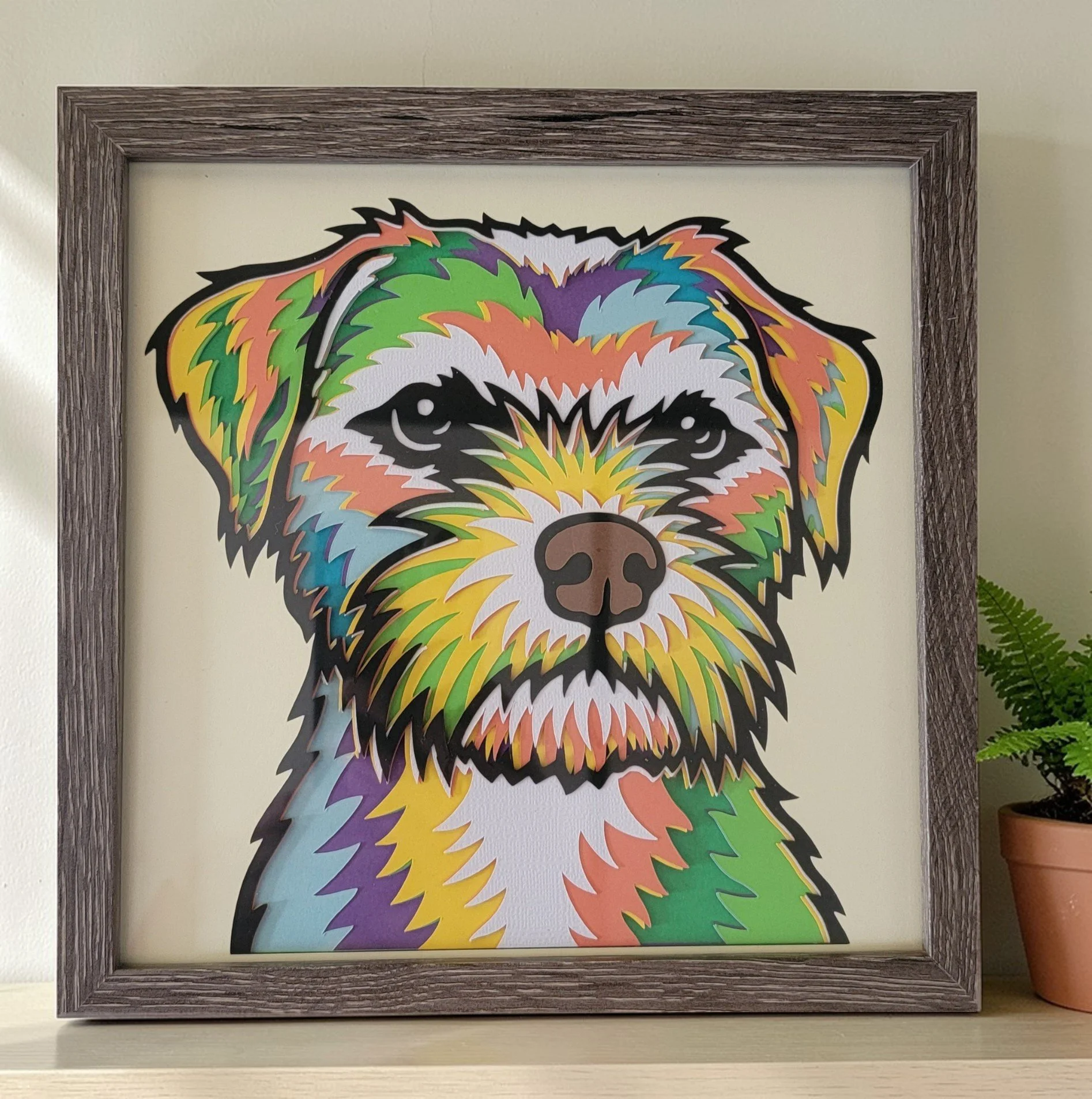 BORDER TERRIER GREY FRAME WITH PLANT.jpg
