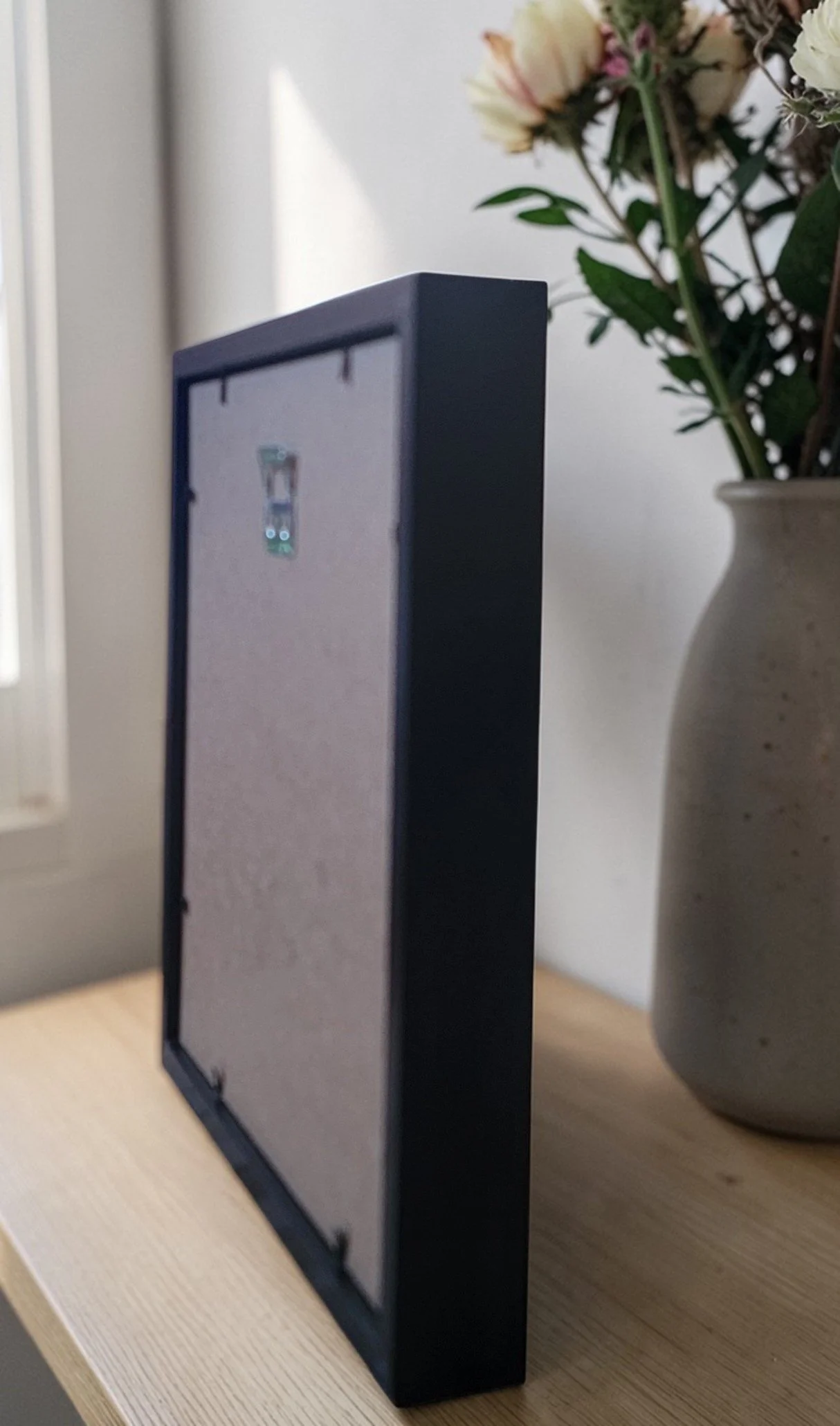 FRAME SIDE VIEW BLACK ON SHELF.jpg