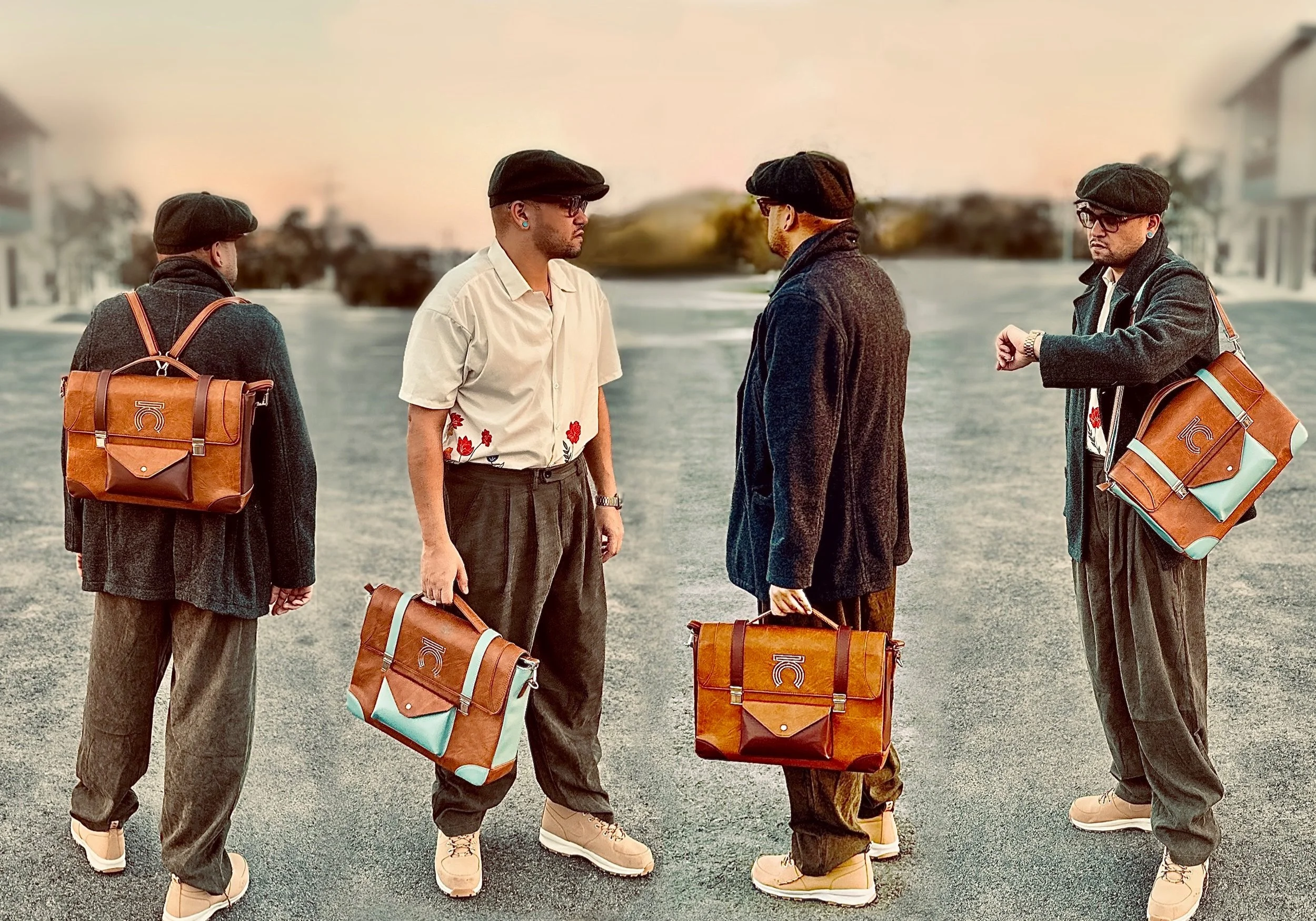 Four men standing outdoors on an empty road during sunset, wearing vintage-style clothing, berets, and carrying leather bags, engaged in conversation.