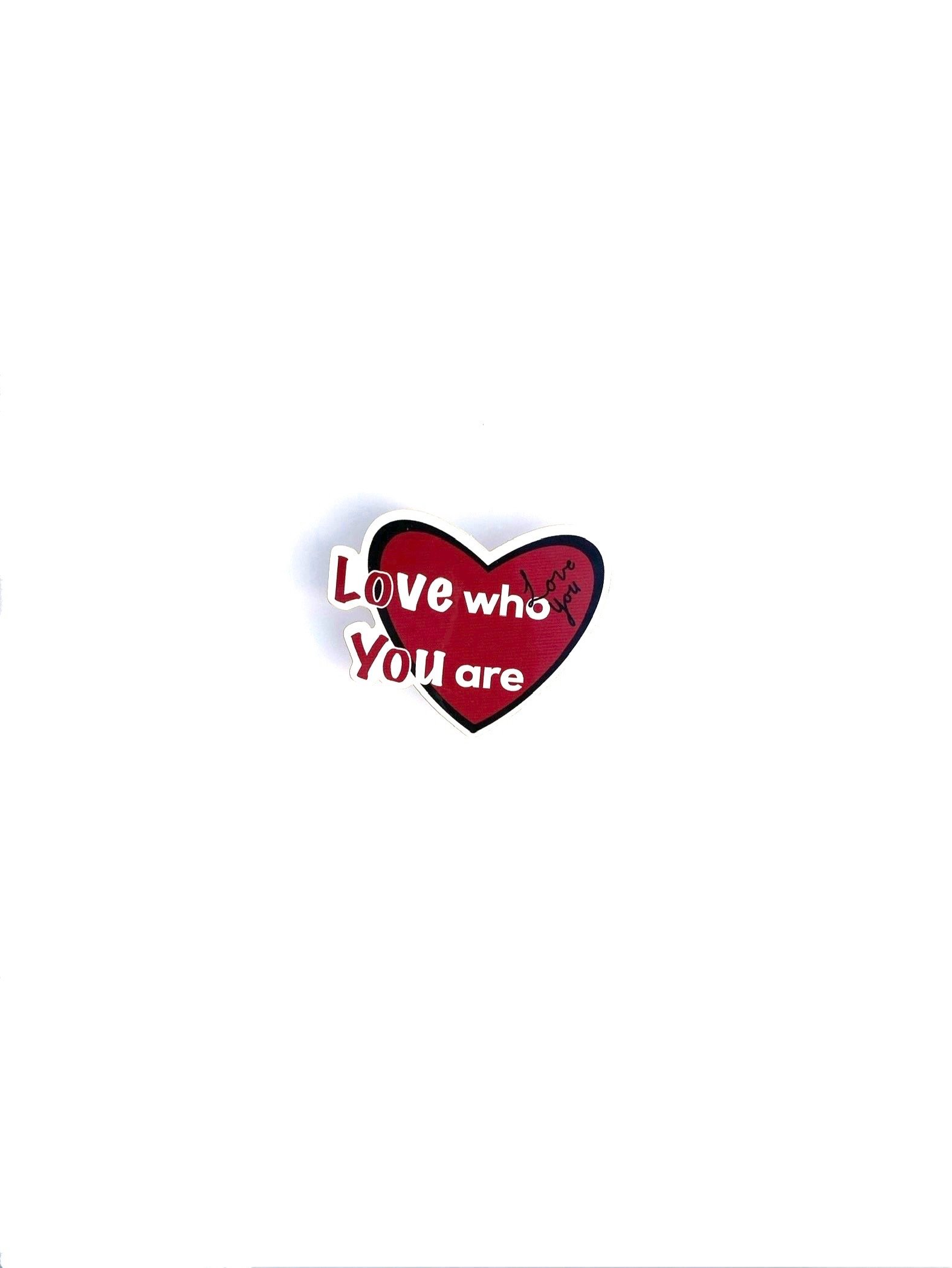 Red heart shaped sticker with the words 'Love who you are' 