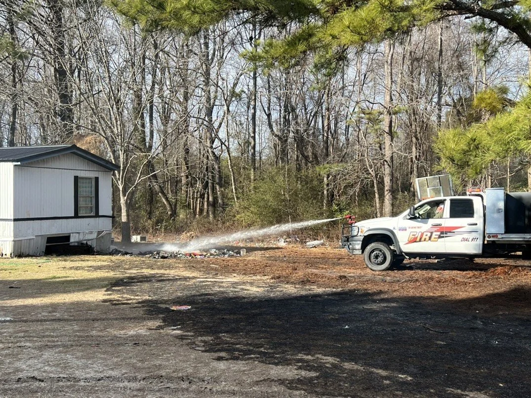 Grass Fire Endangers Home
