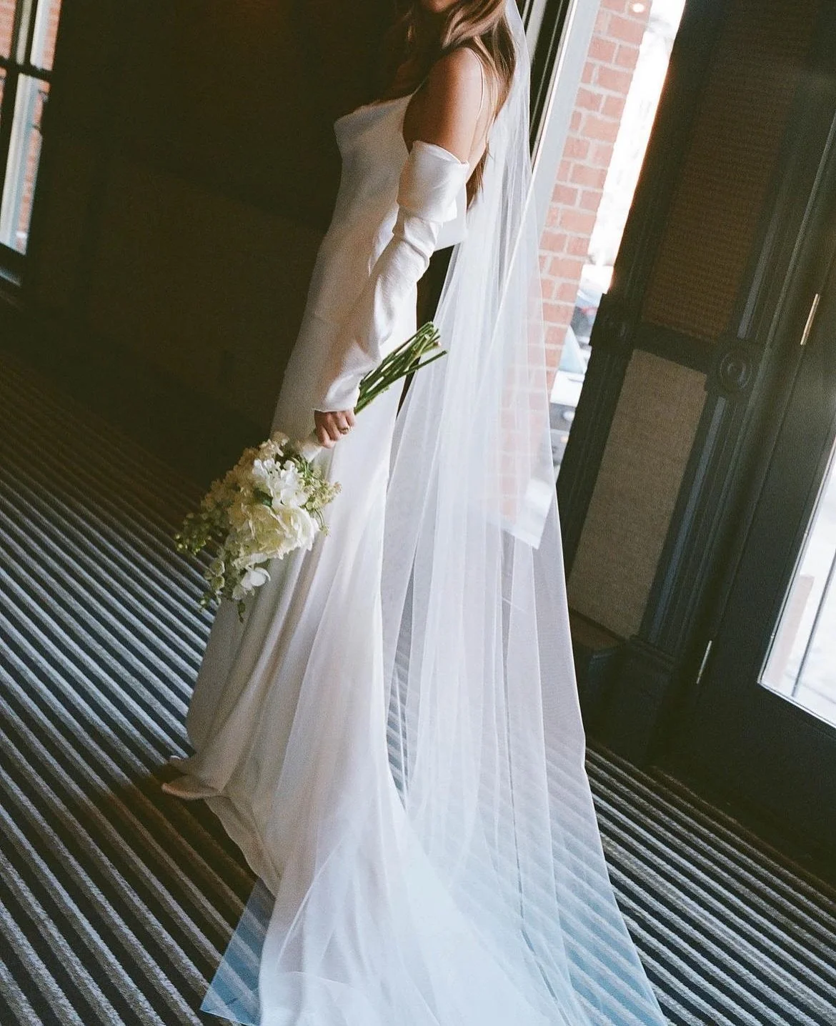 A winter wedding in Aspen, framed in quiet romance.

Emma celebrated her wedding in the Laine gown, layered with the Val jacket chosen at Hope X Page. Soft snow, modern elegance and a bridal style that felt both effortless and refined.

Photography b