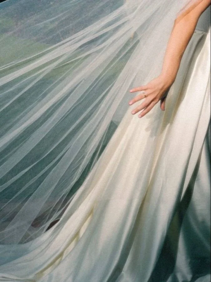 Veils are having a moment again, but in a more considered way.

We&rsquo;re seeing both classic styles and more directional pieces, with softer textures and subtle details that shift the look without overwhelming it.

Less about tradition, more about