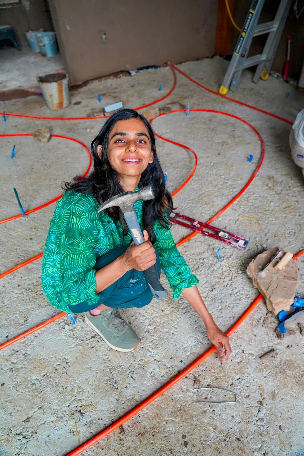 Securing PEX tubing to the base of a limecrete floor