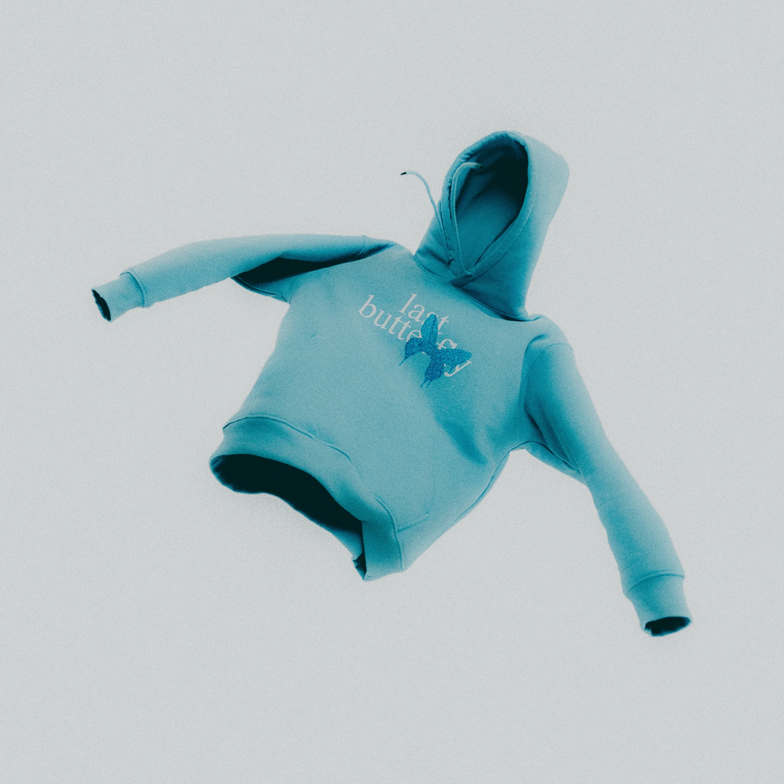 tuotekuva sininen huppari leijuu