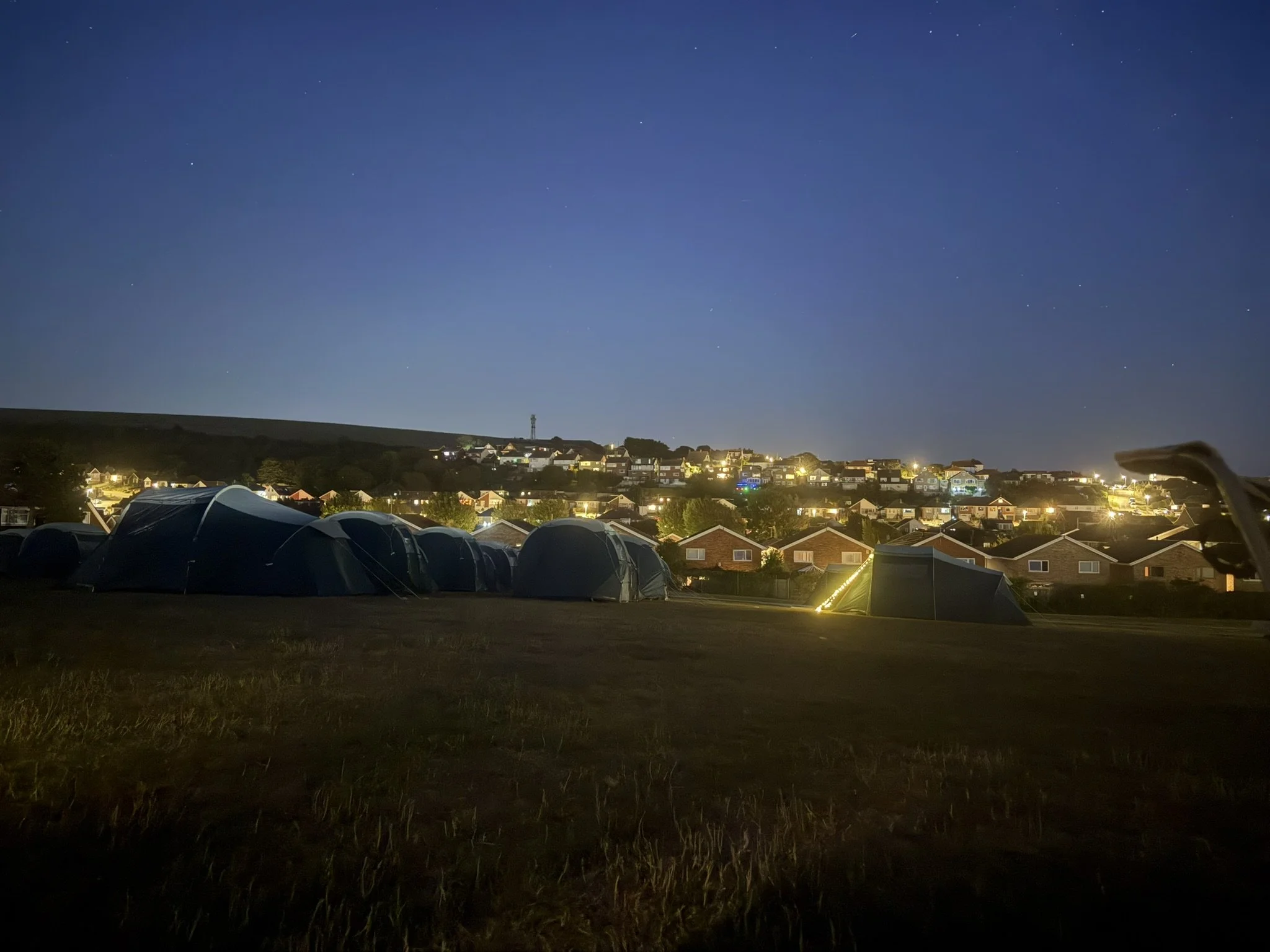 image of tents at night camping in school field