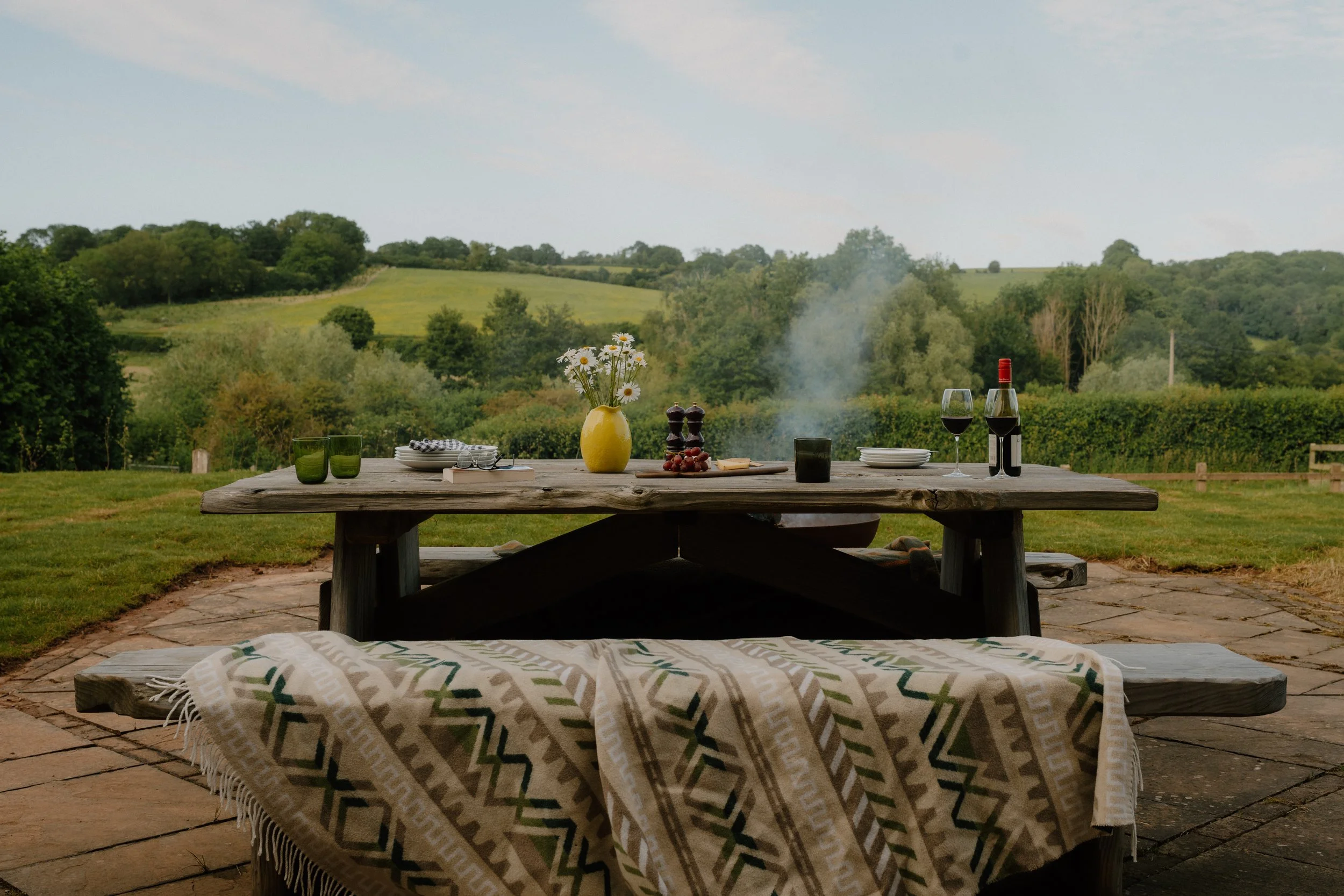 Outdoor garden dining table at the Oast House, Brook House Woods