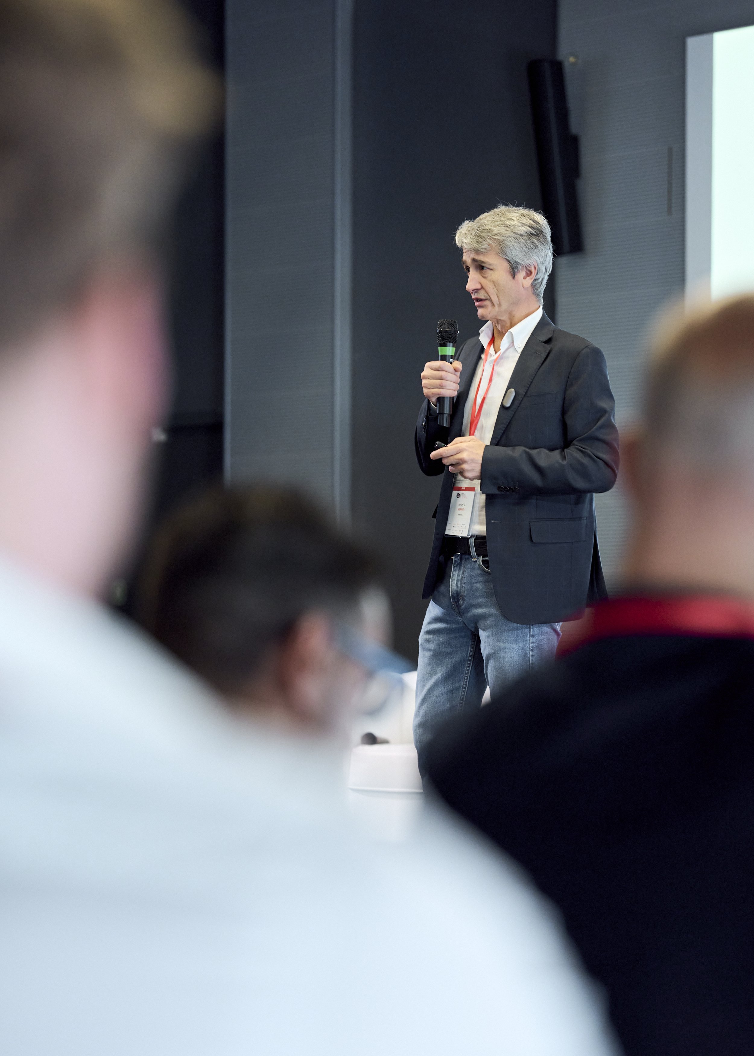 Speaker on stage at Cyberama 2025 cybersecurity conference in Imola
