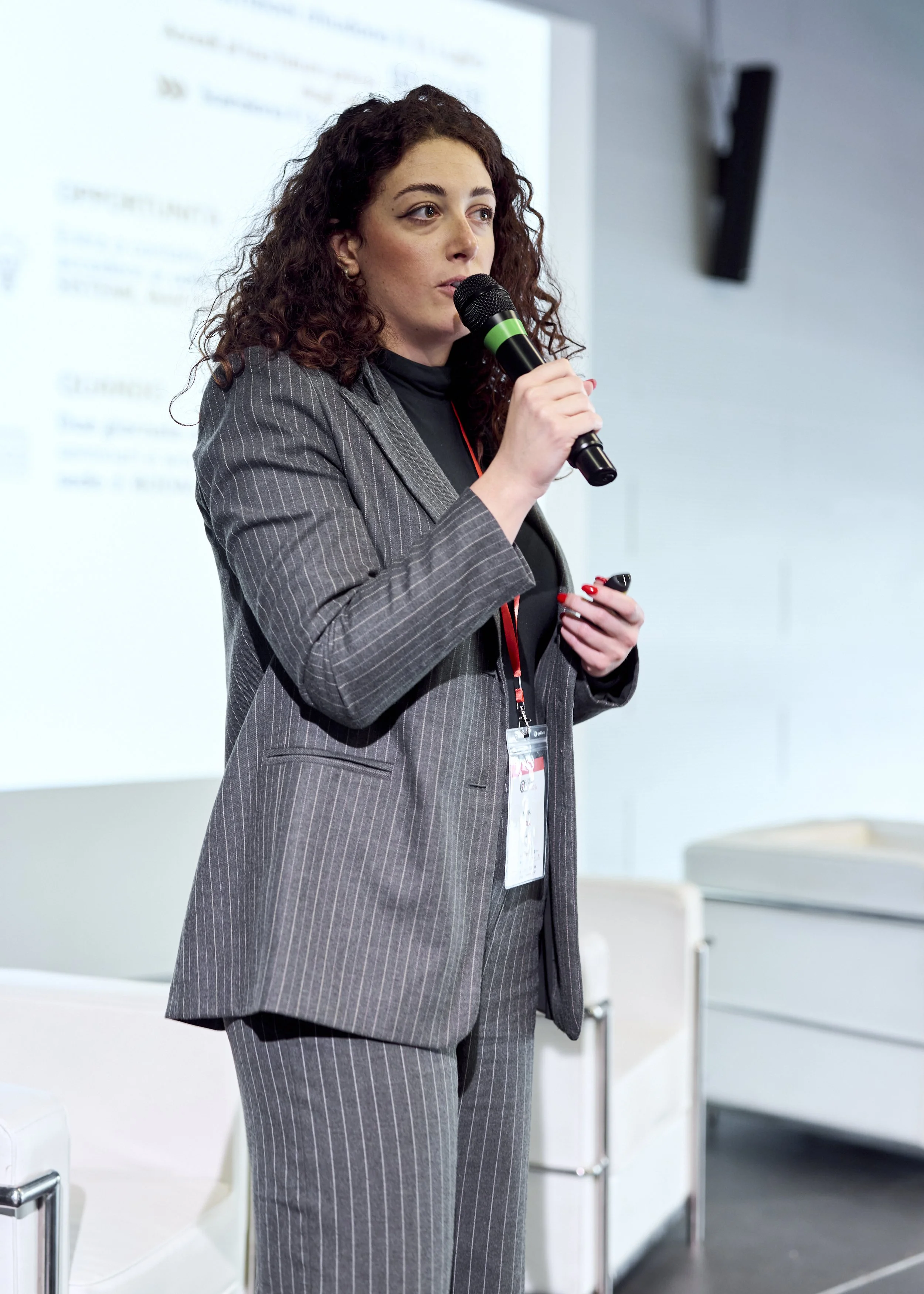 Speaker on stage at Cyberama 2025 cybersecurity conference in Imola