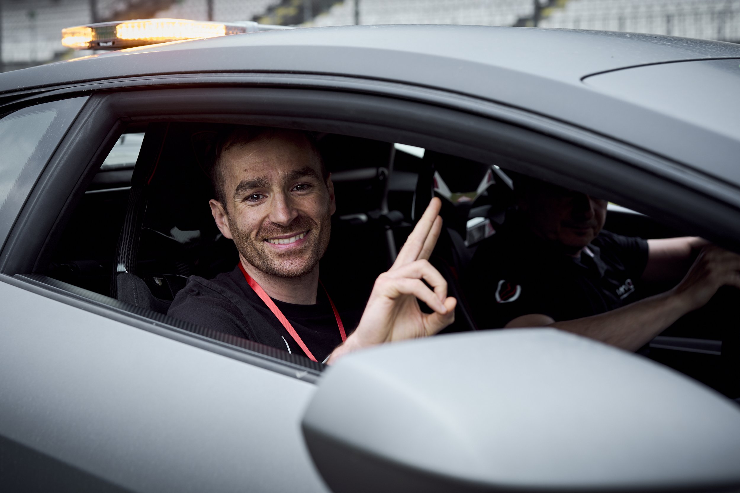 Participants driving their own cars on the Imola circuit during Cyberama 2025