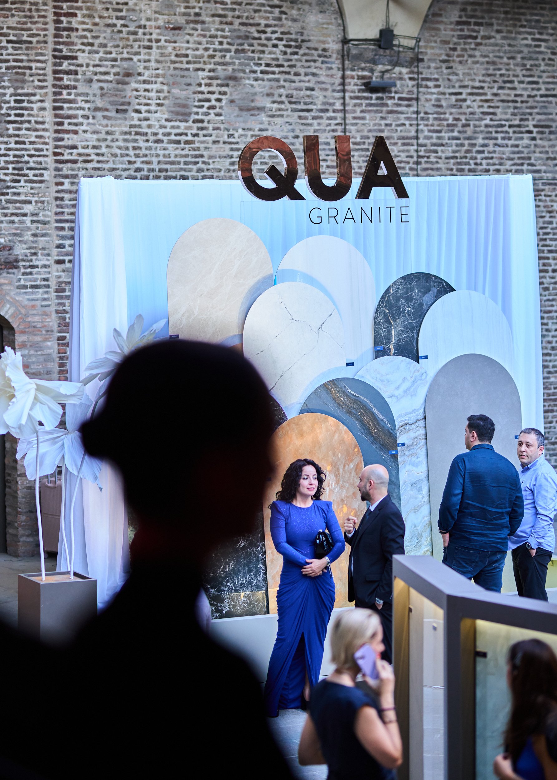 Qua Granite Cersaie closing party set up in the medieval hall of Palazzo Re Enzo, Bologna