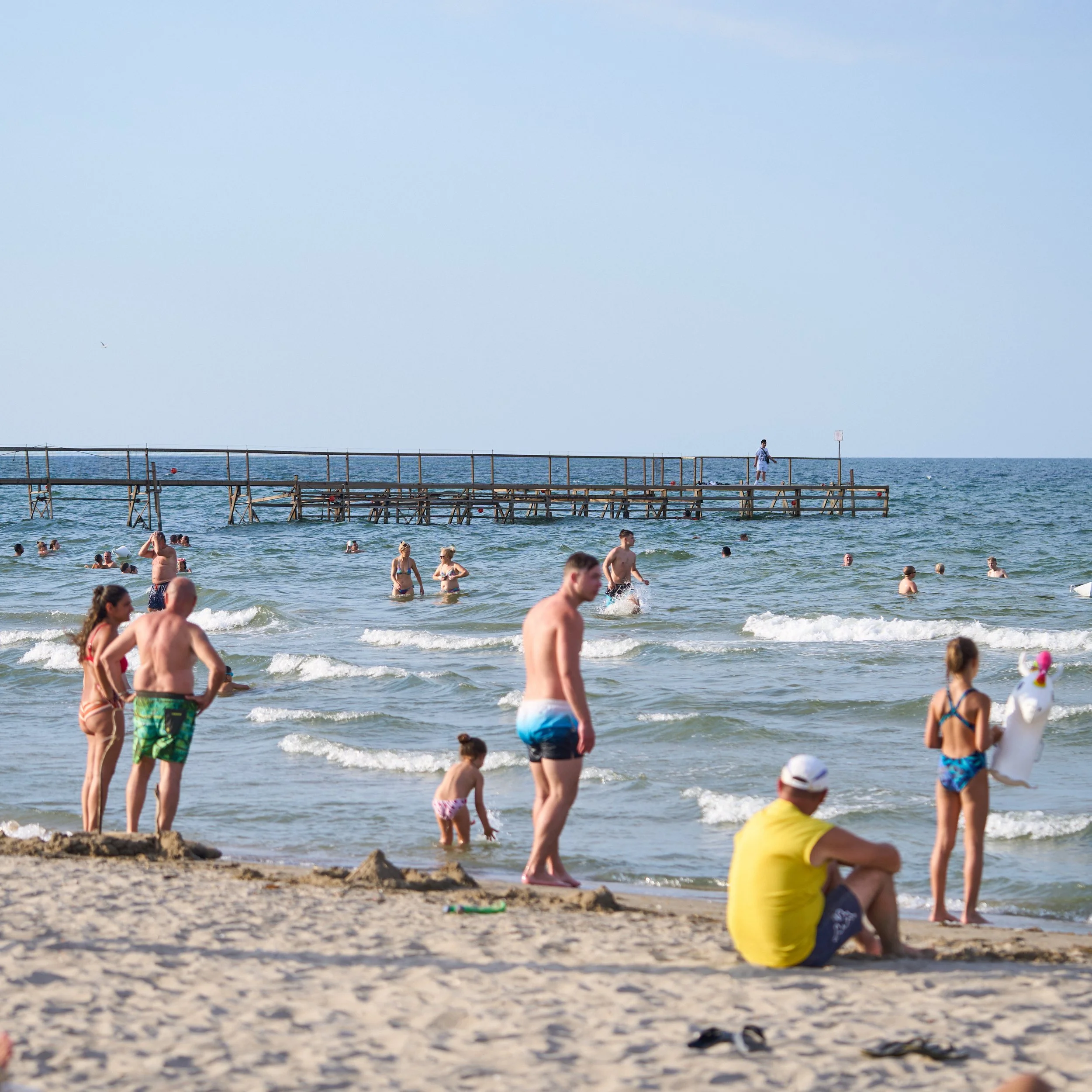 Families on the beach tasting fruit during the Be Fruity event in Rimini
