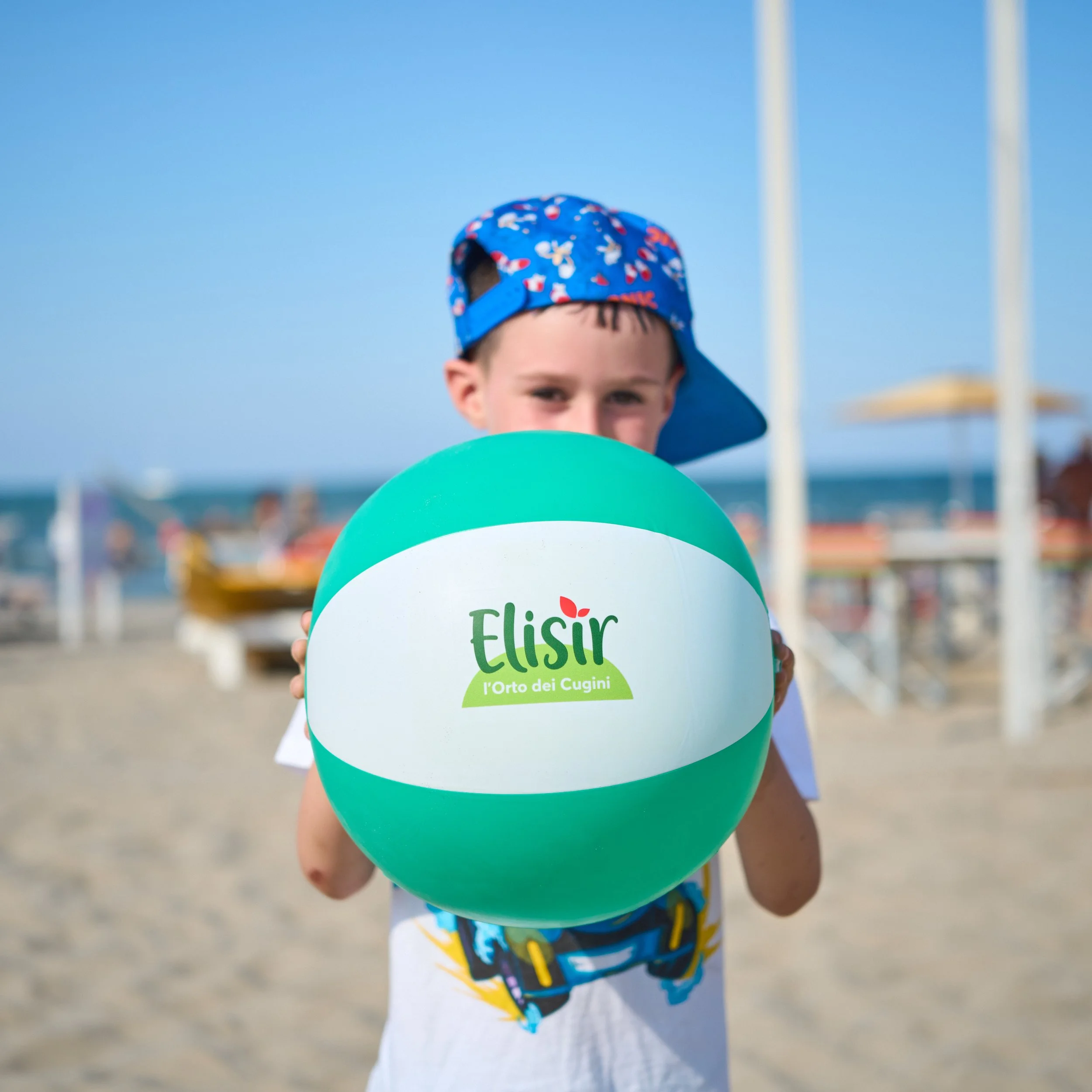 Families on the beach tasting fruit during the Be Fruity event in Rimini