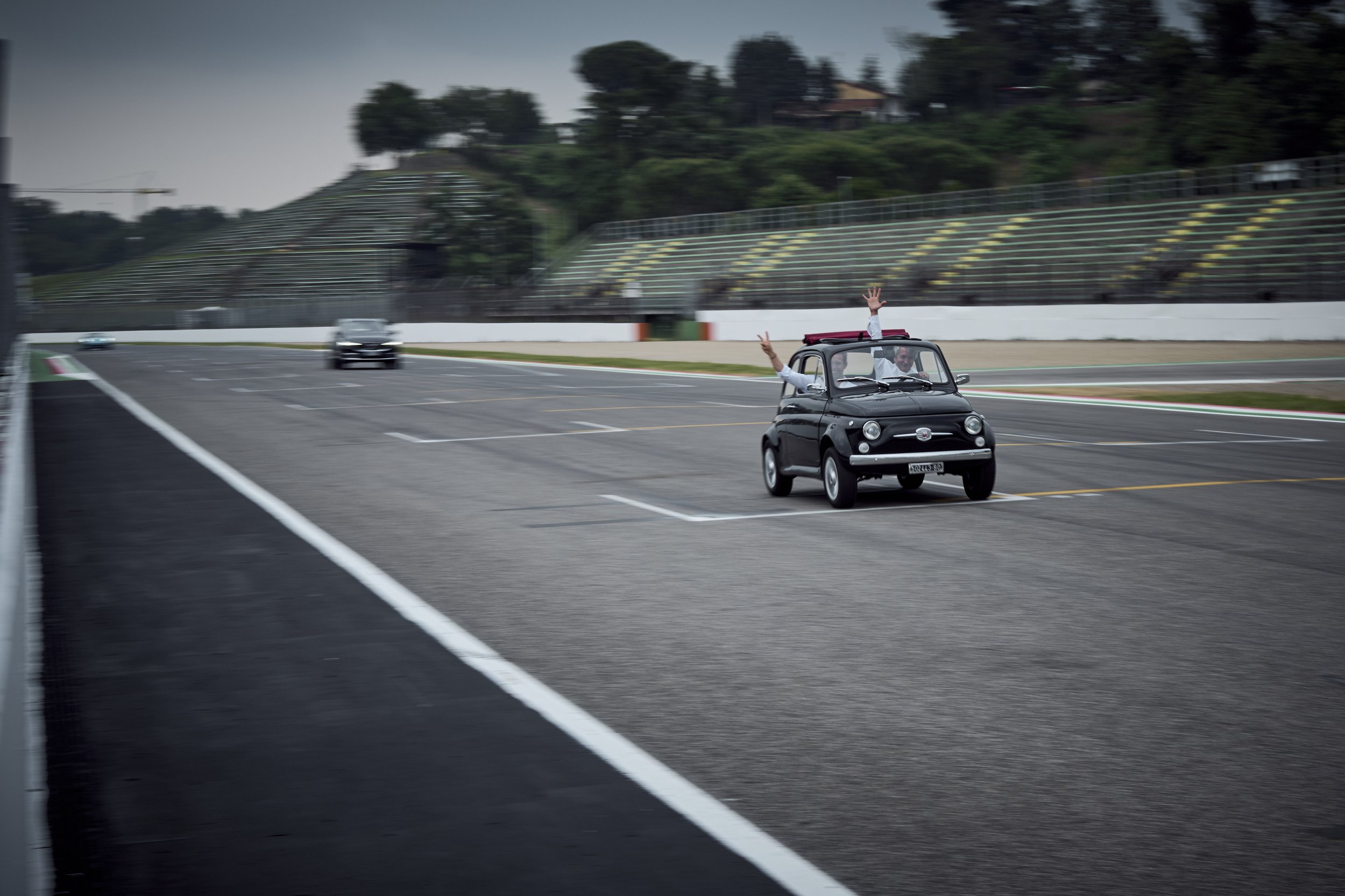 Participants driving their own cars on the Imola circuit during Cyberama 2025