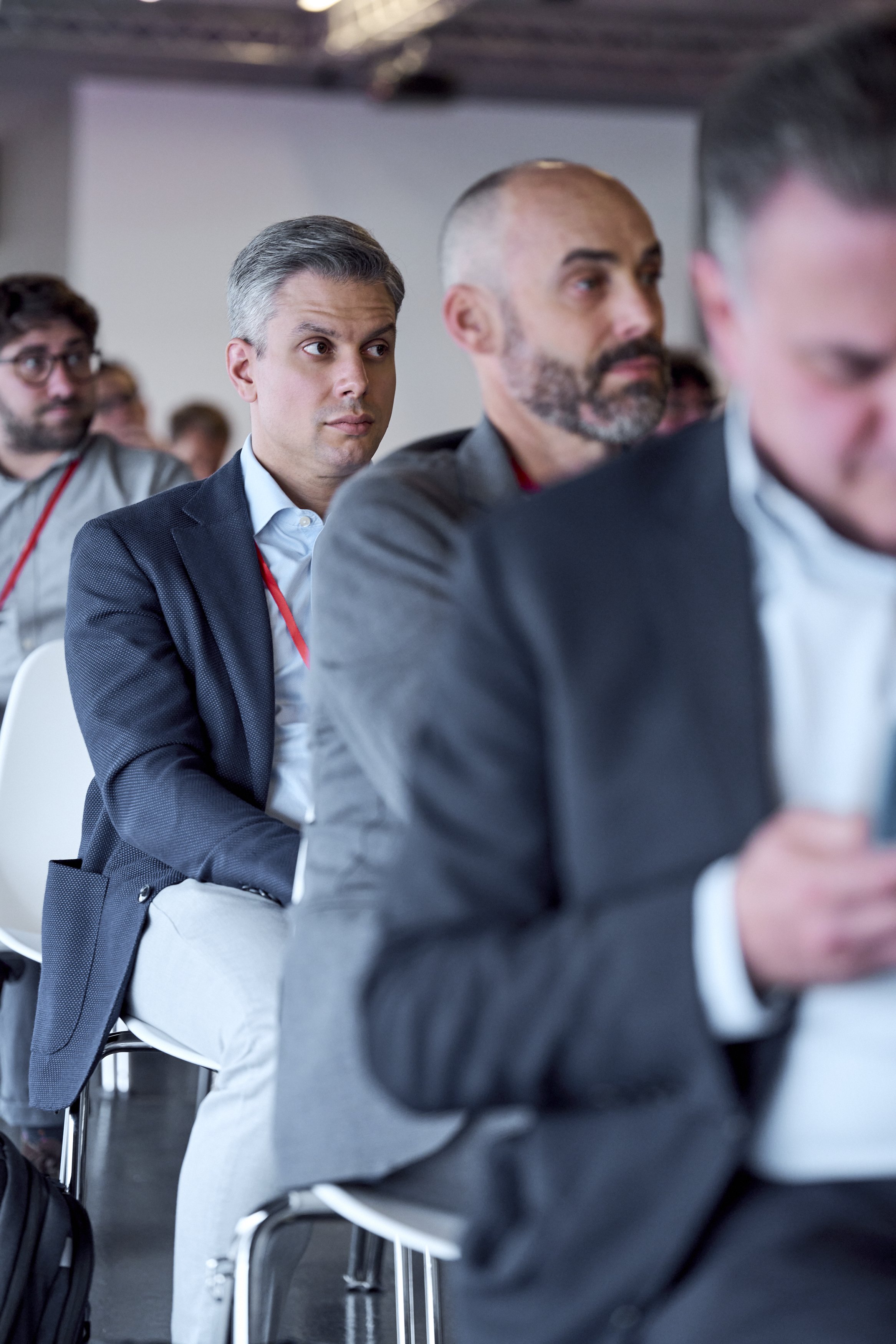 Audience at Cyberama 2025 conference inside the Imola racetrack