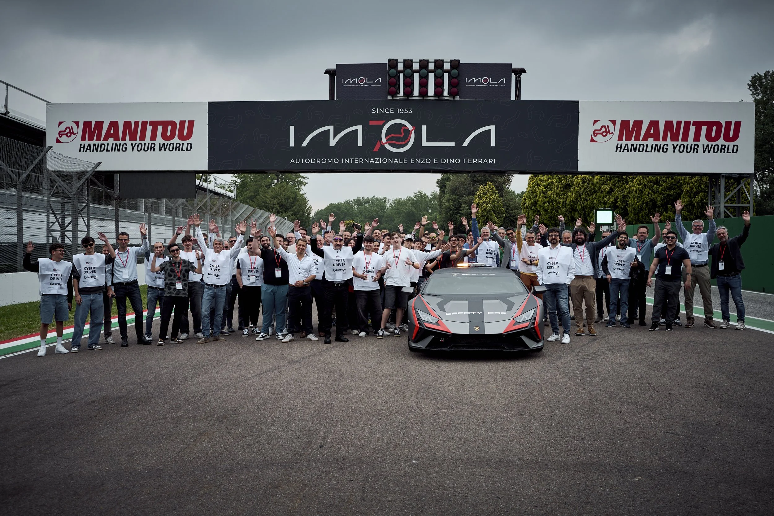 Participants driving their own cars on the Imola circuit during Cyberama 2025