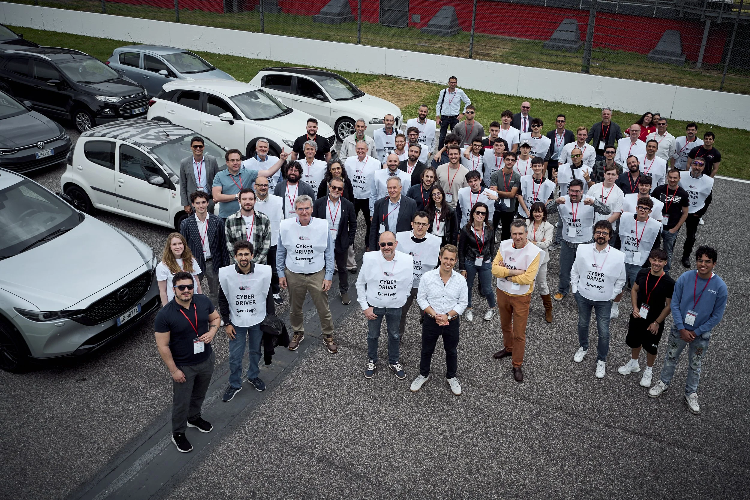 Participants driving their own cars on the Imola circuit during Cyberama 2025