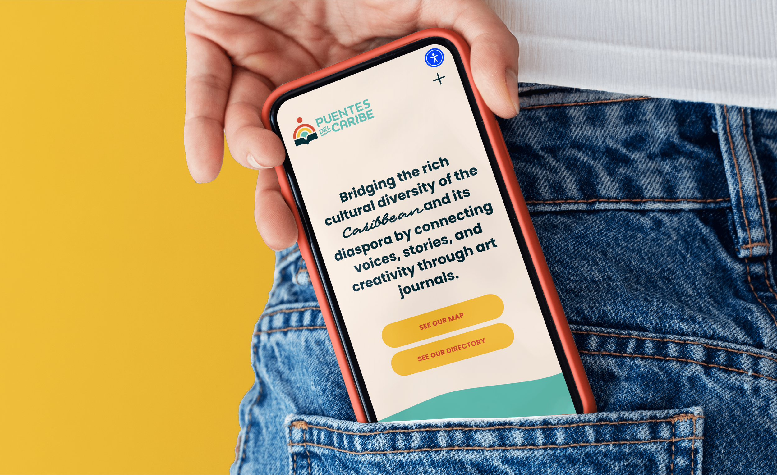 Hand taking a phone out of a jeans pocket. The phone has a peachy orange-red cover and displays Puentes del Caribe’s mobile homepage design on its screen.