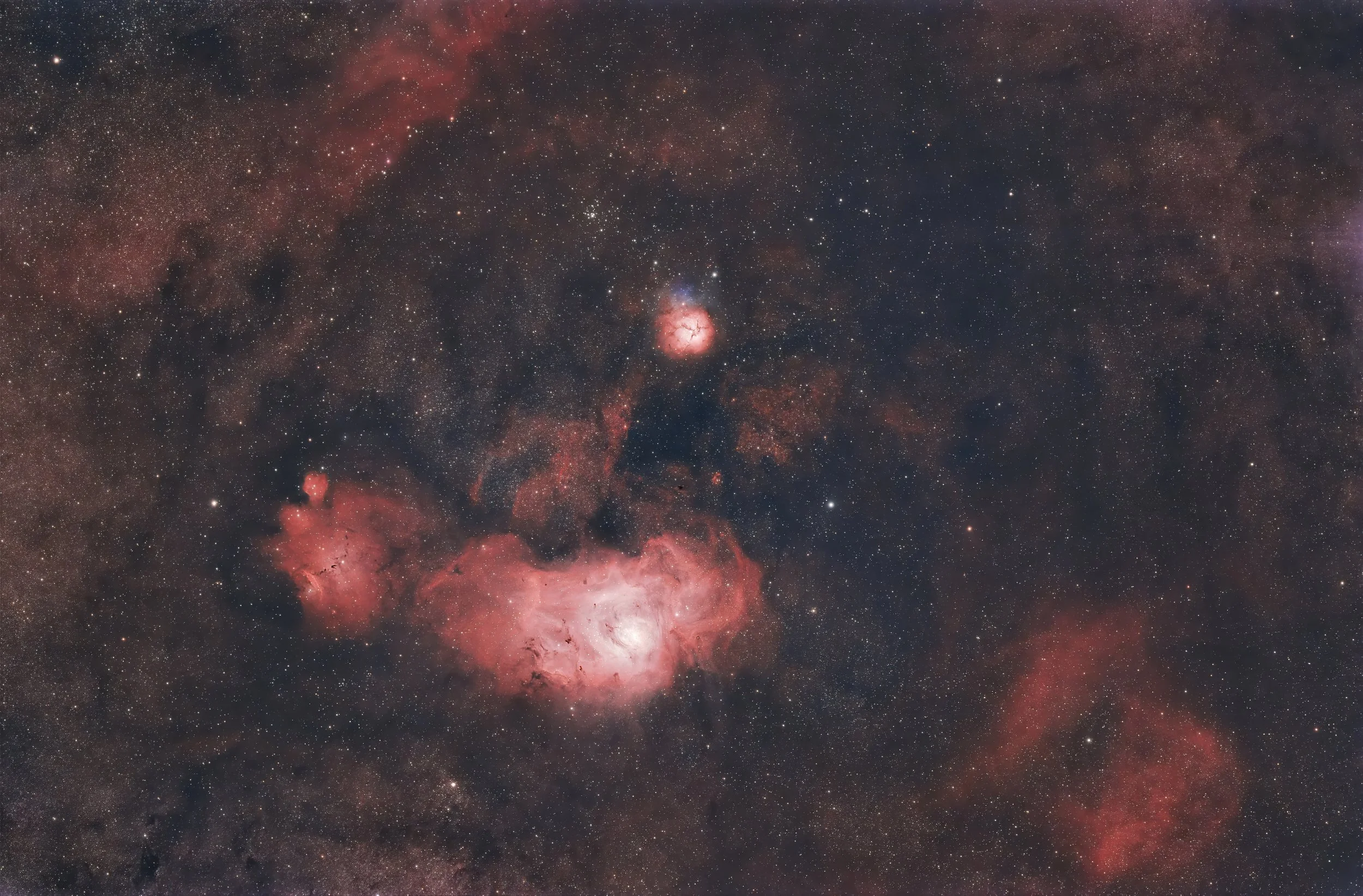 Lagoon, Trifid, and Cat's Paw Nebula