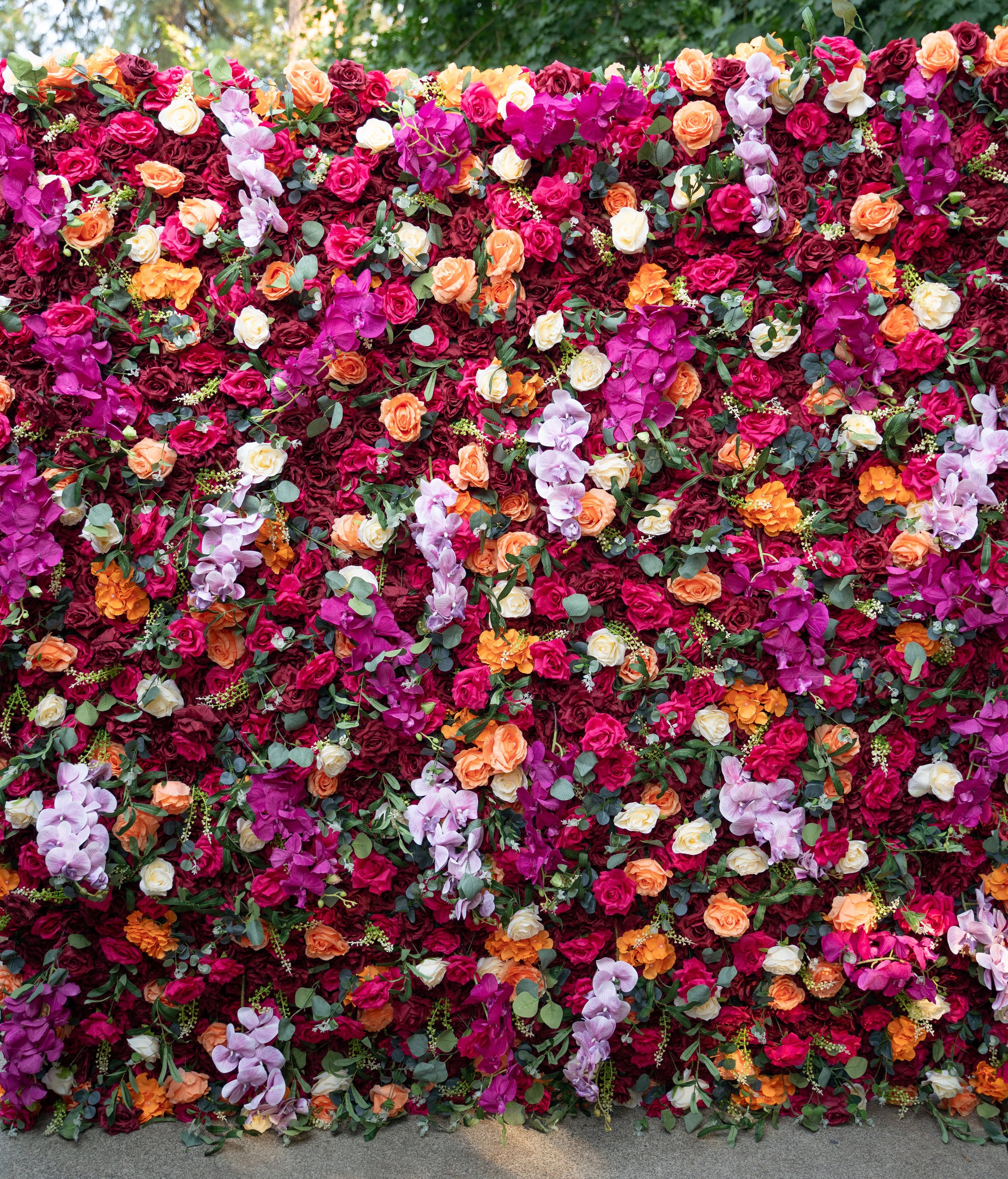 A stunning 8x8 floral backdrop featuring lush, realistic blooms arranged for a beautiful, dimensional look. This statement piece creates an elegant photo moment. 