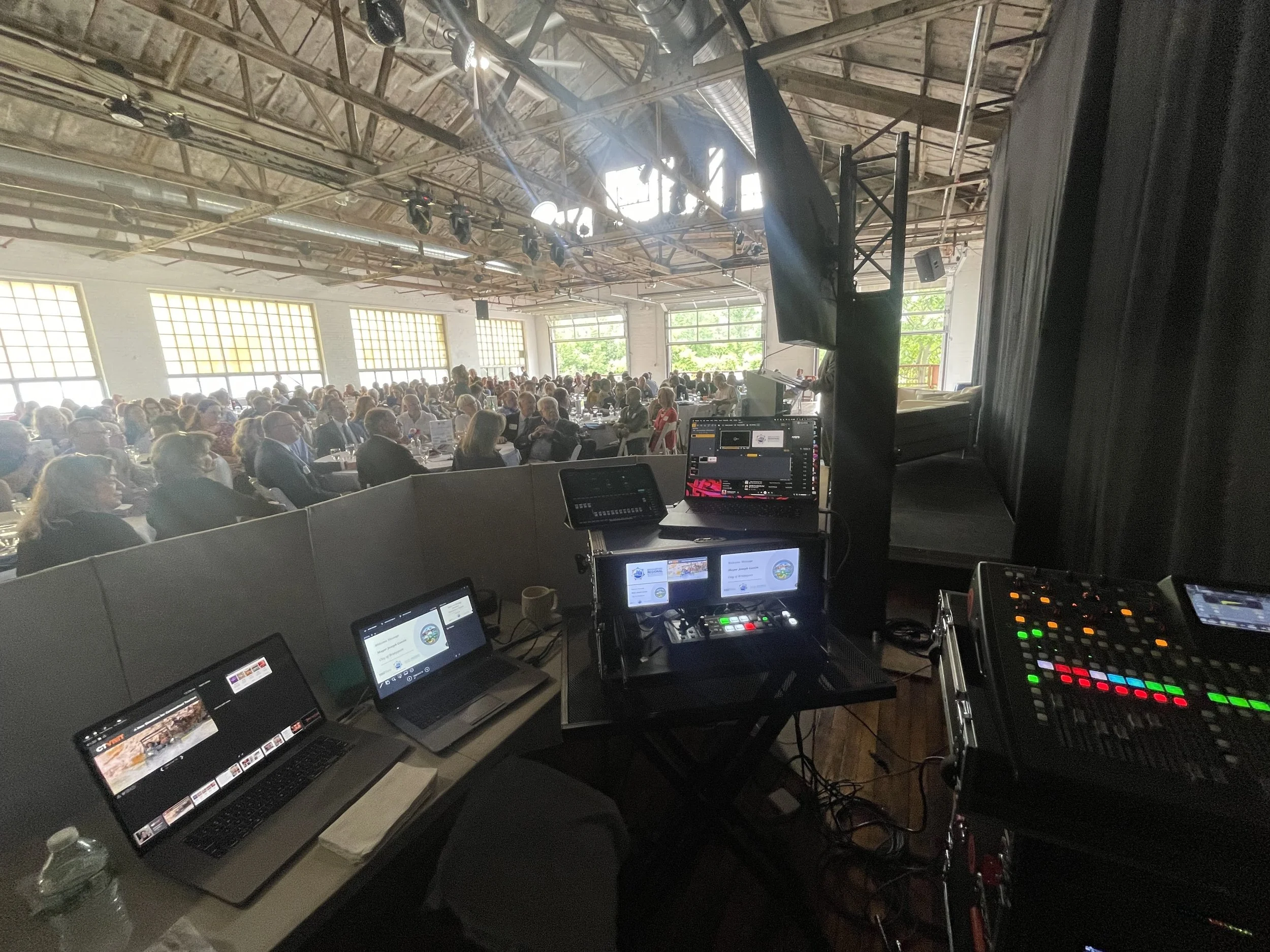 Behind-the-scenes AV booth with live switching for nonprofit gala