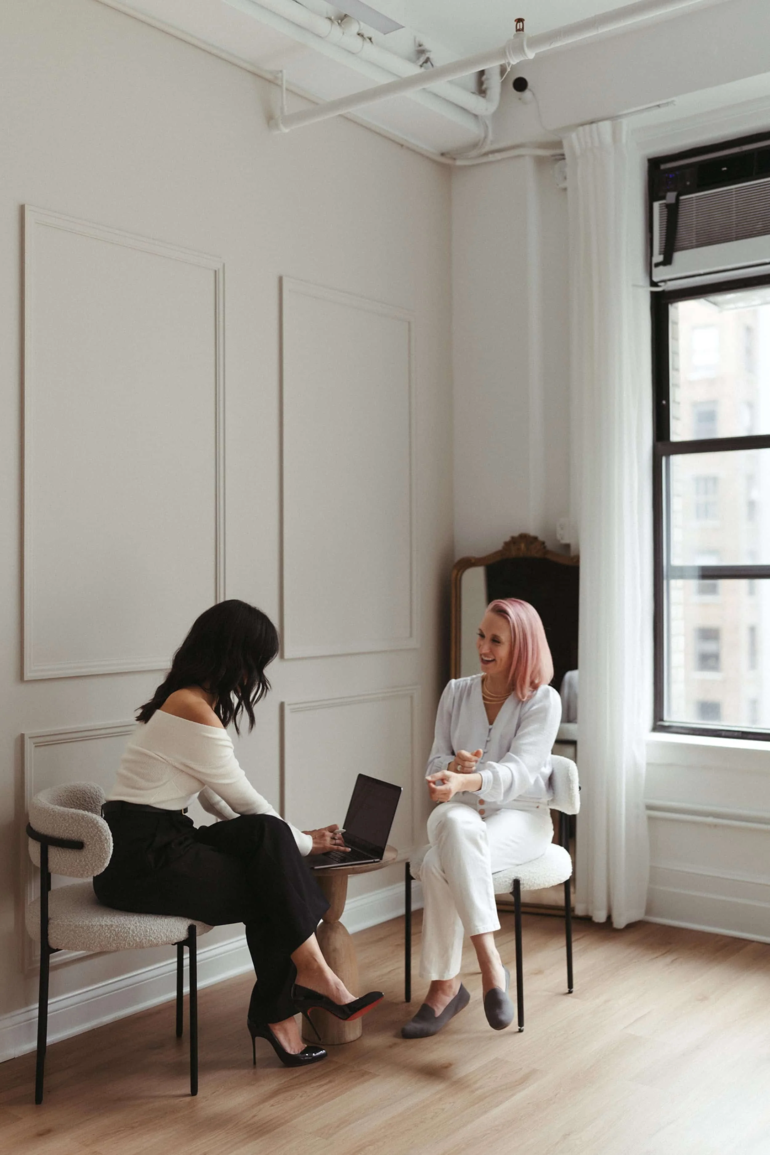 Mika Mooney meeting with a client during a business and trademark law consultation.