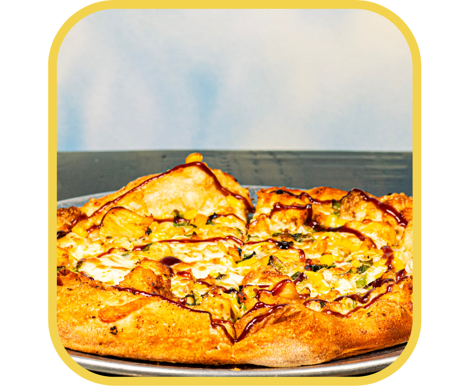 A close-up of a pizza with cheese, chicken, green peppers, and a drizzle of barbecue sauce on a white plate.