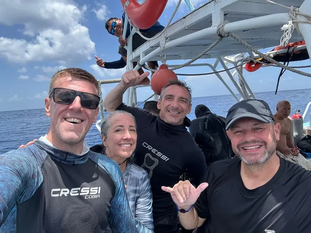 Luke Coley and Ricard Barnden with members of a diving group in Cozumel, Mexico