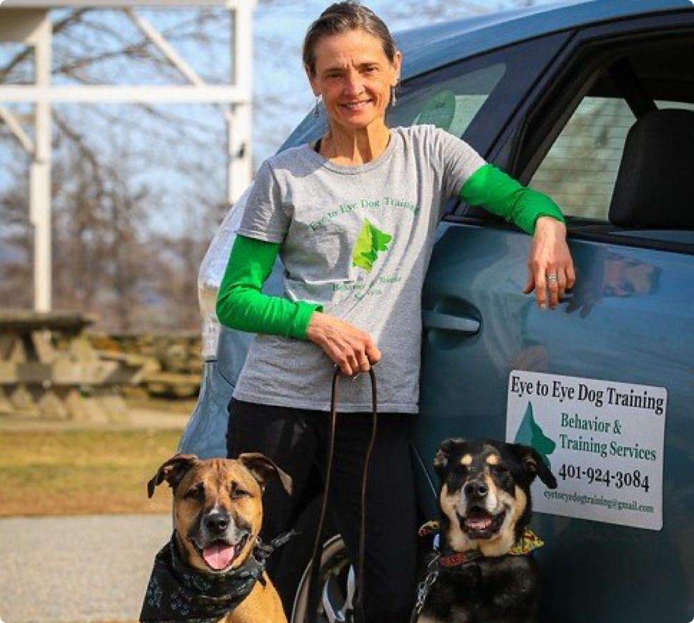 Kim Cipolla, owner, poses by her car with her two well-behaved dogs