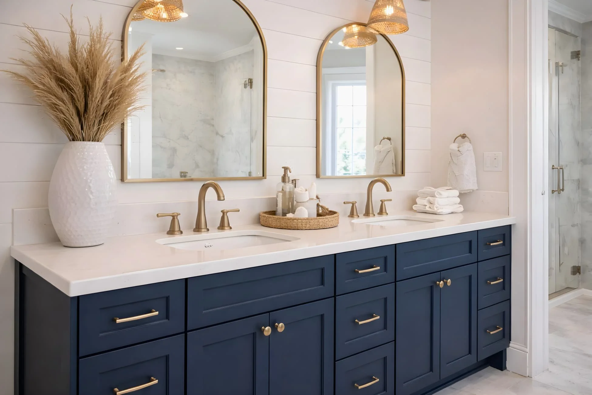 Installed navy blue bathroom vanity as part of a professional bathroom remodeling project by MDI Custom Homes