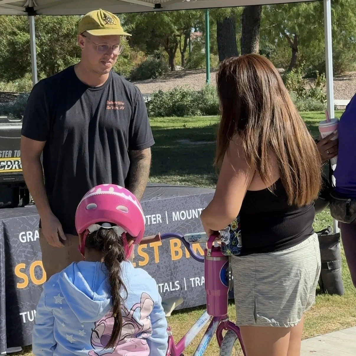 Southwest Bikes Staff Help Family with Bike Tires.jpg